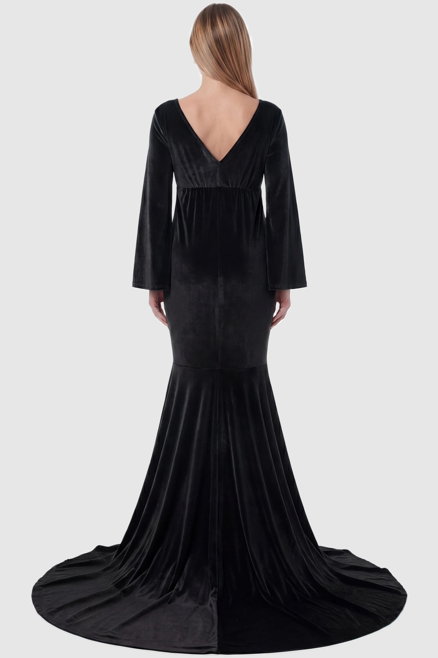 Velvet Long Bell Sleeve Maternity Mermaid Gown Velvet Long Bell Sleeve Maternity Mermaid Gown in Black featuring a V-neck back on a pregnant model.