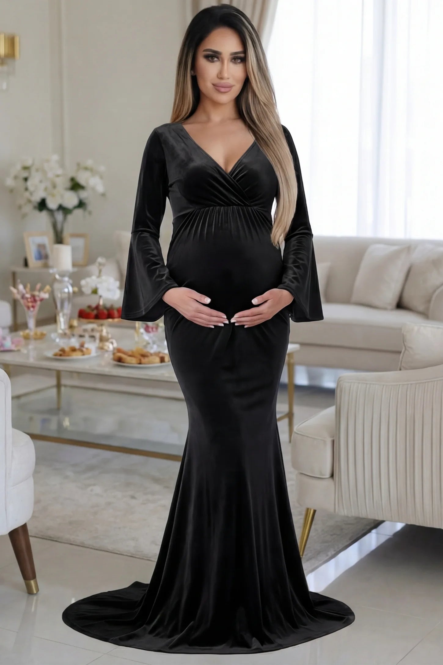 Velvet Long Bell Sleeve Maternity Mermaid Gown Velvet Long Bell Sleeve Maternity Mermaid Gown in Black featuring a front-facing pregnant silhouette with a long train.