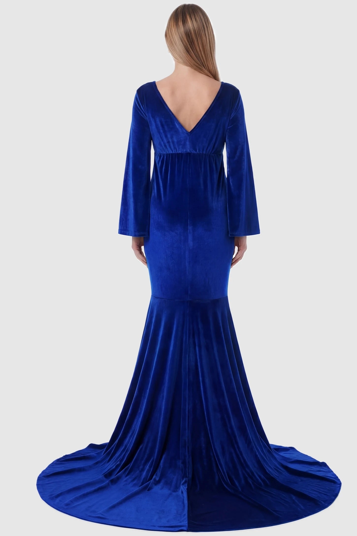 Velvet Long Bell Sleeve Maternity Mermaid Gown Velvet Long Bell Sleeve Maternity Mermaid Gown in Blue featuring a V-neck back on a pregnant model.