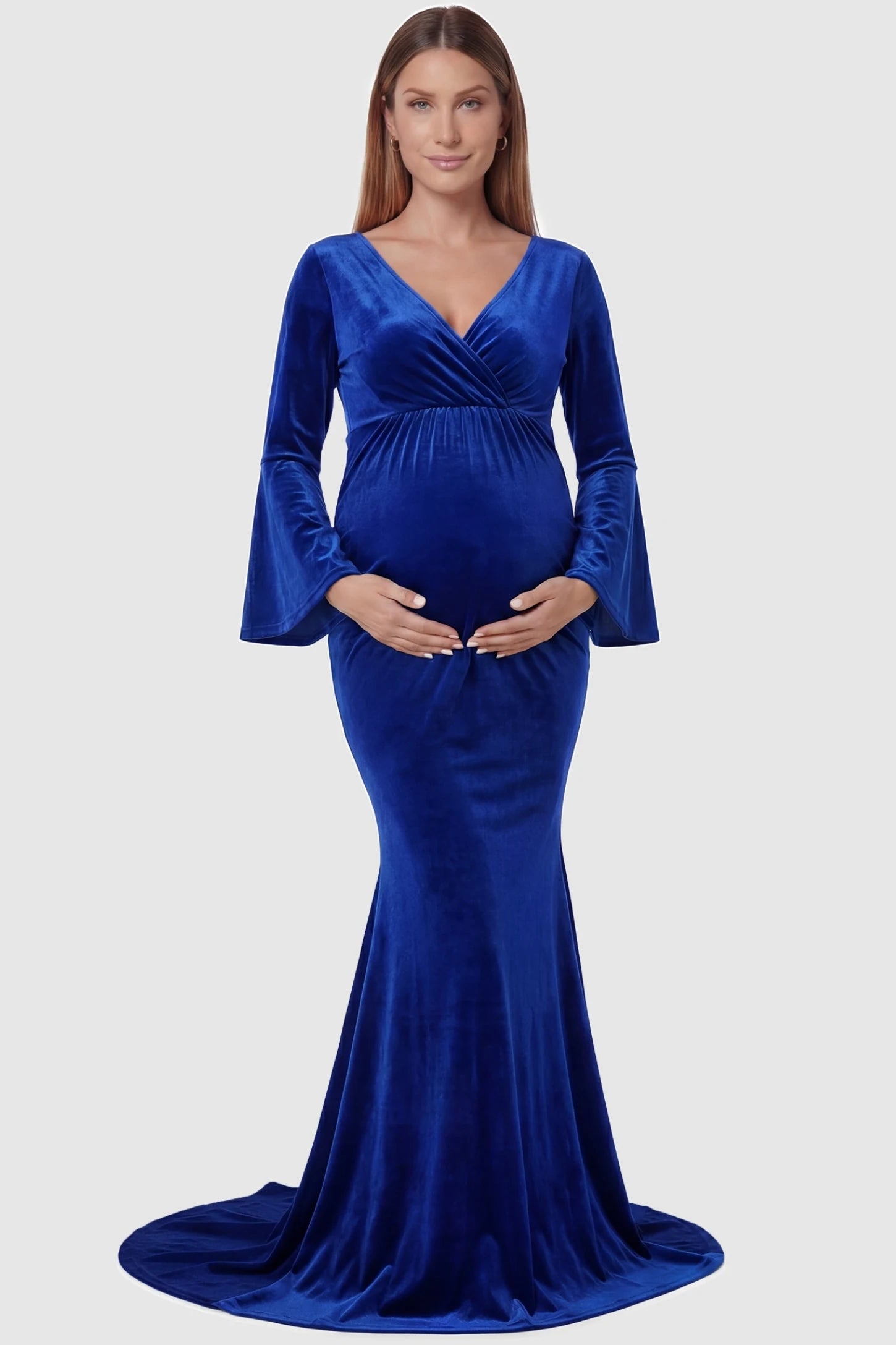 Velvet Long Bell Sleeve Maternity Mermaid Gown Velvet Long Bell Sleeve Maternity Mermaid Gown in Blue featuring a front-facing pregnant silhouette with a long train.