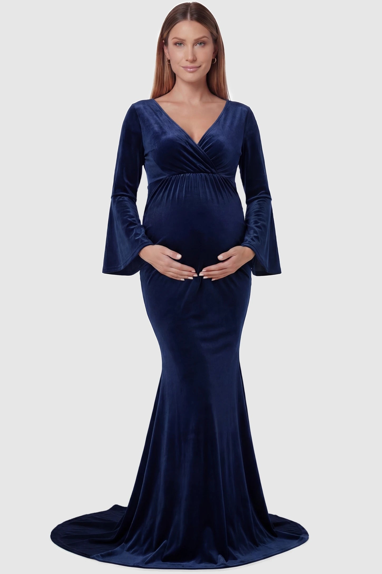 Velvet Long Bell Sleeve Maternity Mermaid Gown Velvet Long Bell Sleeve Maternity Mermaid Gown in Dark Blue featuring a front-facing pregnant silhouette with a long train.