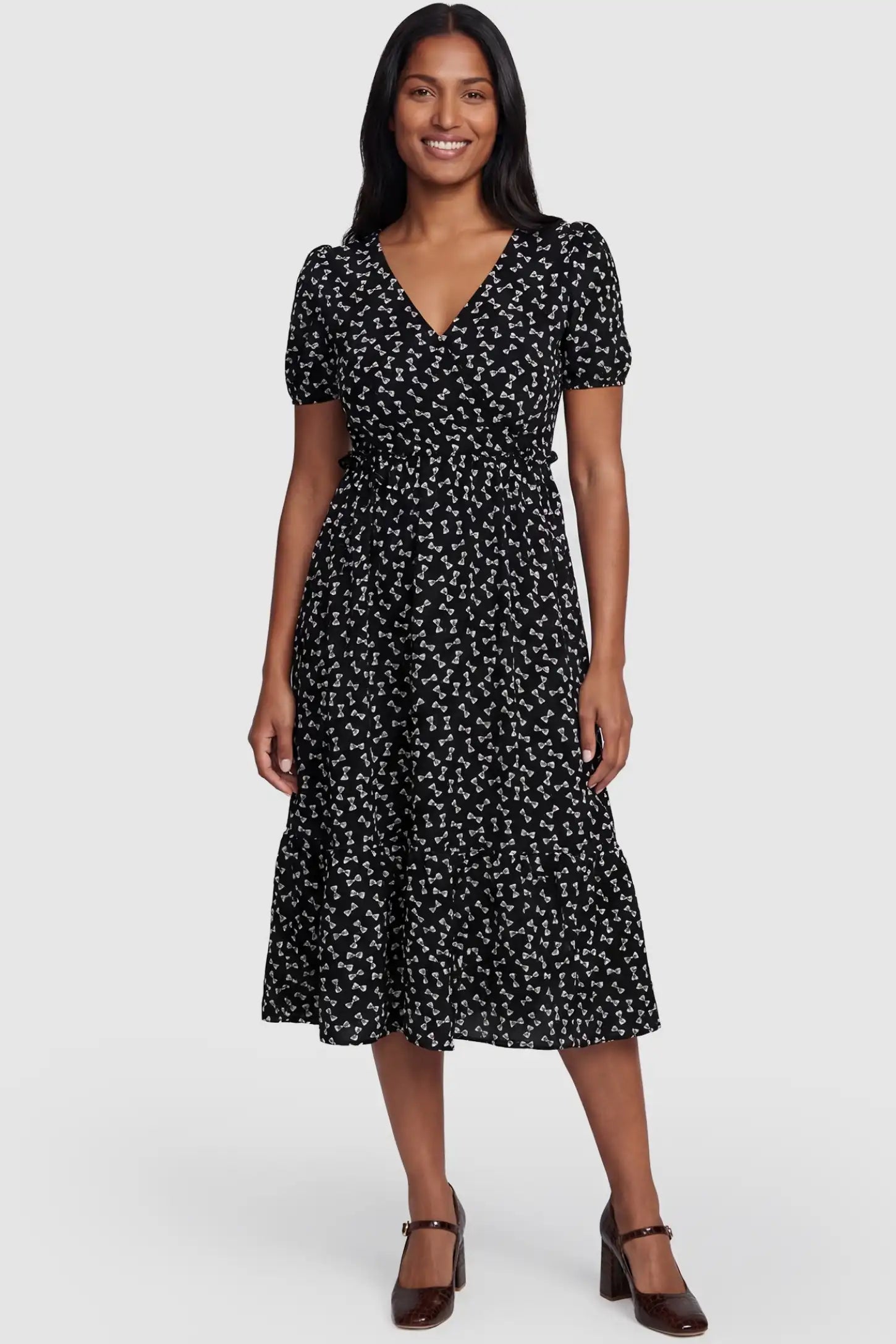Bow-Print Wrap Midi Maternity Dress Bow-Print Wrap Midi Maternity Dress in bow-tie pattern featuring a high-waist A-line cut on a non-pregnant model.