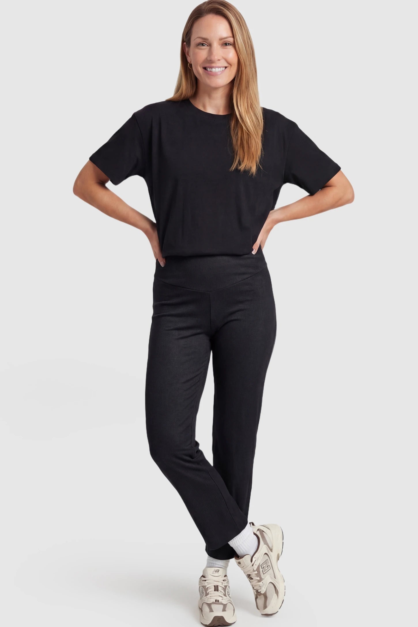 Adjustable Elastic Waist Straight Leg Maternity Pants Straight Leg Maternity Pants in black featuring an adjustable elastic waist on a postpartum model showing front.