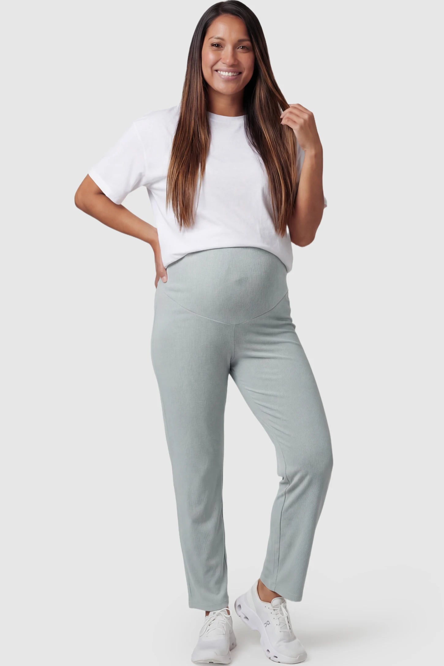 Adjustable Elastic Waist Straight Leg Maternity Pants Straight Leg Maternity Pants in Green featuring an adjustable elastic waist on a pregnant model posing front.