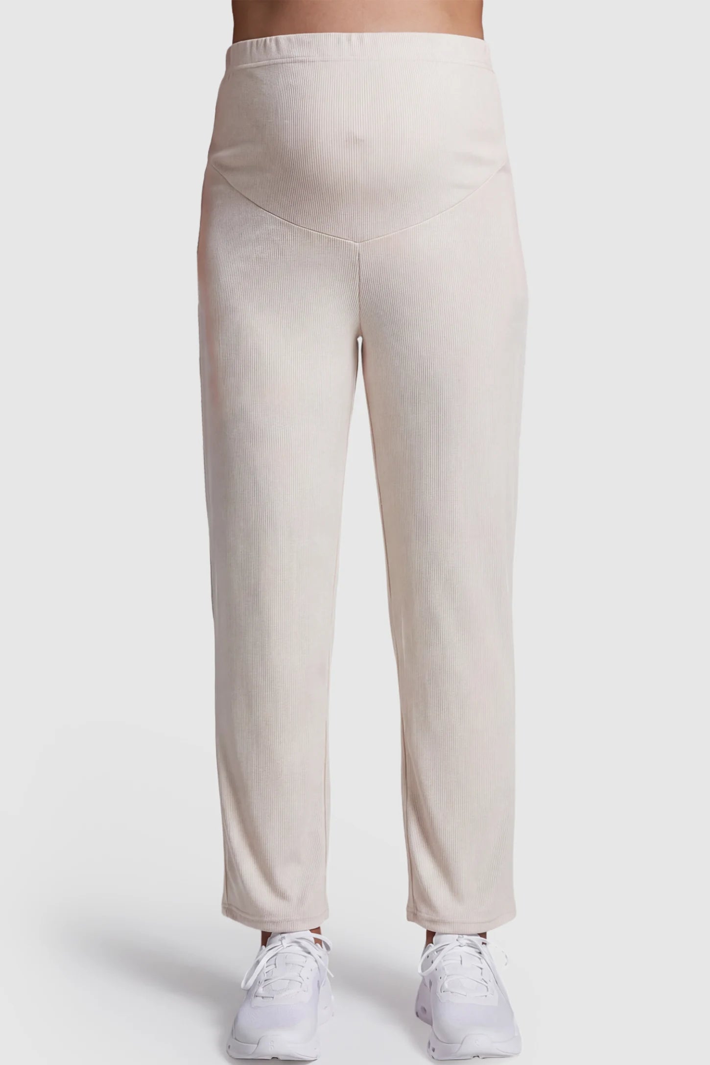 Adjustable Elastic Waist Straight Leg Maternity Pants Straight Leg Maternity Pants in light apricot featuring an adjustable elastic waist on a pregnant model showing front.