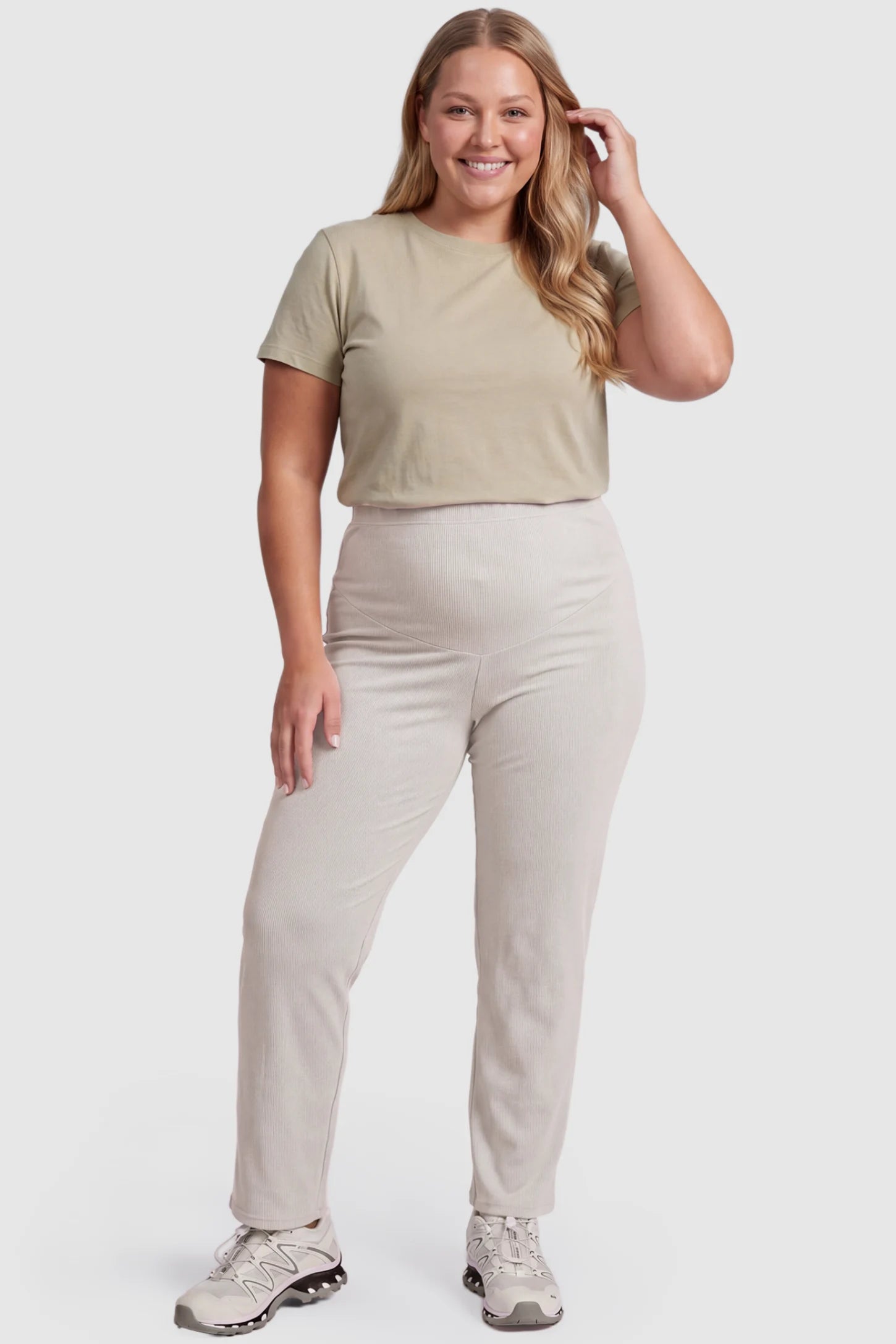Adjustable Elastic Waist Straight Leg Maternity Pants Straight Leg Maternity Pants in light apricot featuring an adjustable elastic waist on a plus size pregnant model, front view.