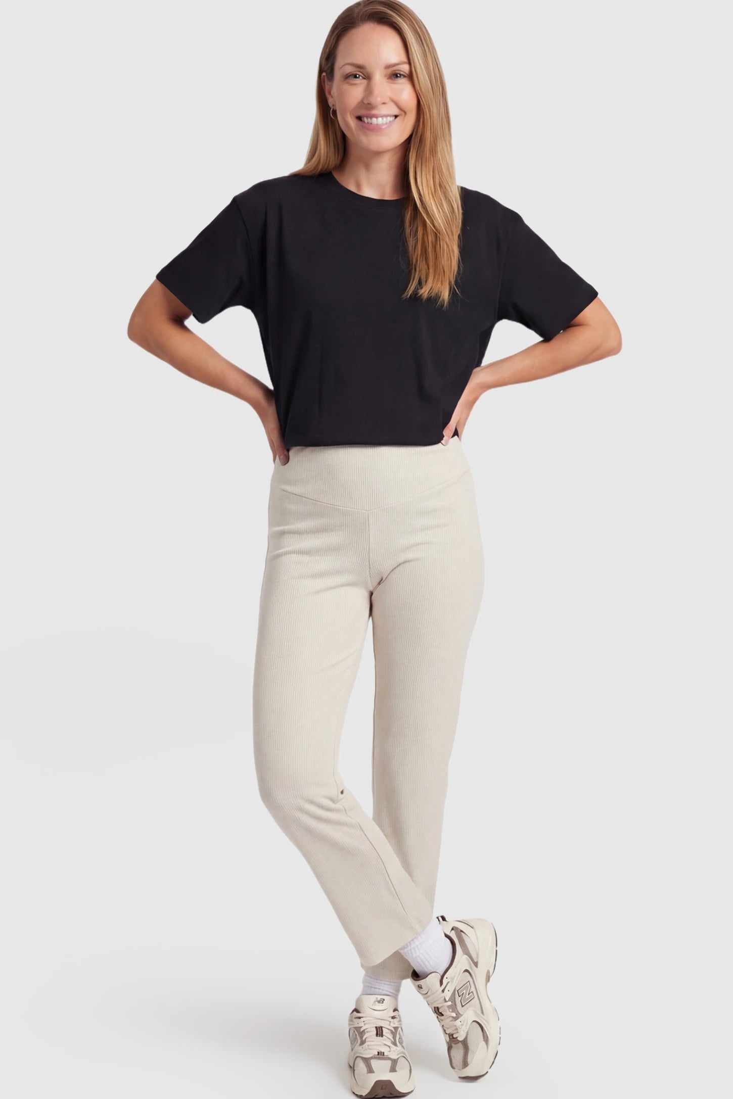 Adjustable Elastic Waist Straight Leg Maternity Pants Straight Leg Maternity Pants in light apricot featuring an adjustable elastic waist on a postpartum model showing front.