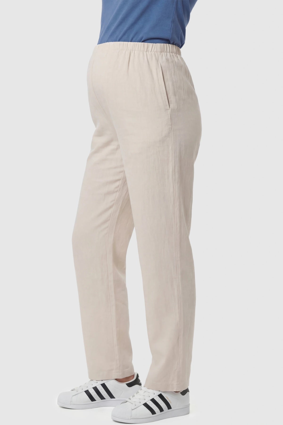 Adjustable Elastic Waist Wide Leg Maternity Pants Adjustable Elastic Waist Wide-Leg Maternity Pants in Beige featuring a customizable button-hole waistband on a pregnant model showing side.