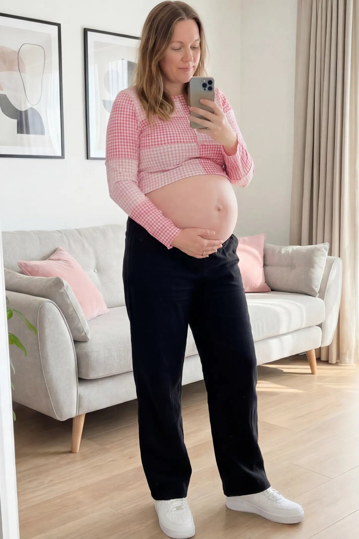 Adjustable Elastic Waist Wide Leg Maternity Pants Adjustable Elastic Waist Wide-Leg Maternity Pants in Black featuring a customizable button-hole waistband on a pregnant woman.