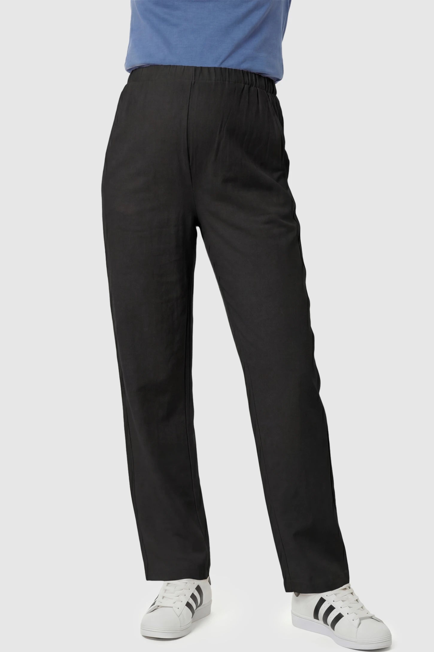 Adjustable Elastic Waist Wide-Leg Maternity Pants in Black featuring a customizable button-hole waistband on a pregnant model showing front.