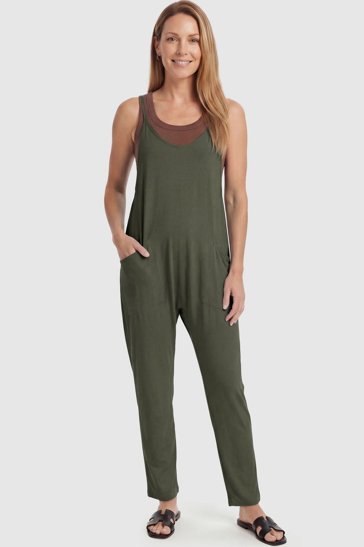 Adjustable Strap Pocketed Relaxed Maternity Jumpsuit Adjustable Strap Pocketed Maternity Jumpsuit in Army Green featuring a flexible fit on a non-pregnant model, front view.