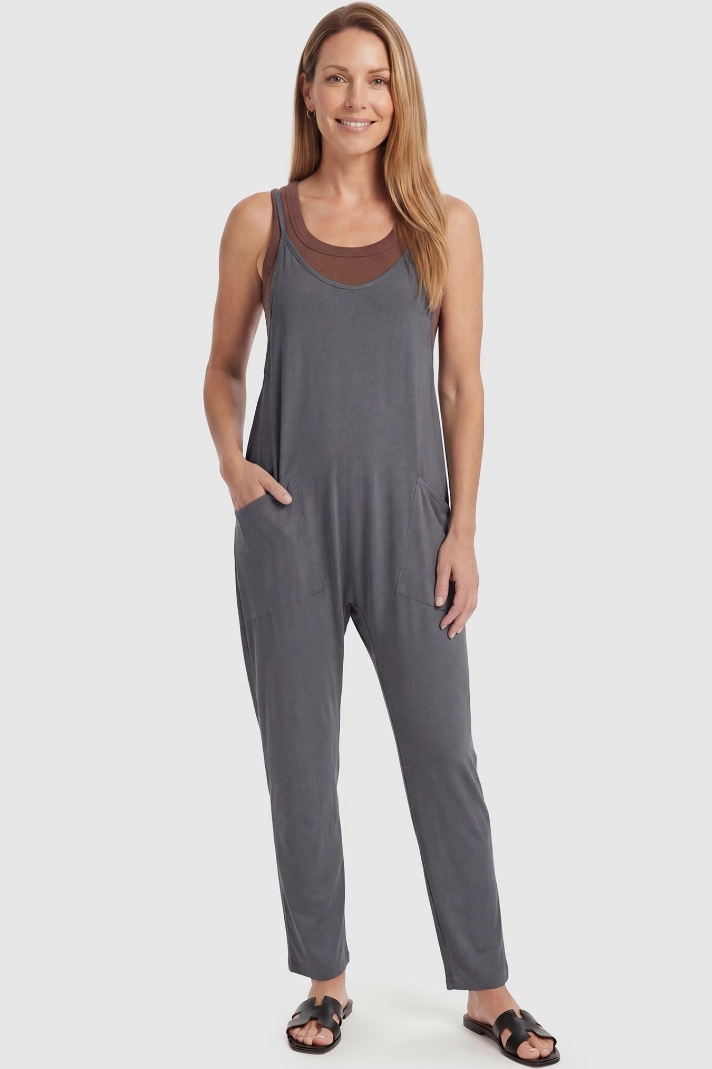 Adjustable Strap Pocketed Relaxed Maternity Jumpsuit Adjustable Strap Pocketed Maternity Jumpsuit in Dark Gray featuring a flexible fit on a non-pregnant model, front view.