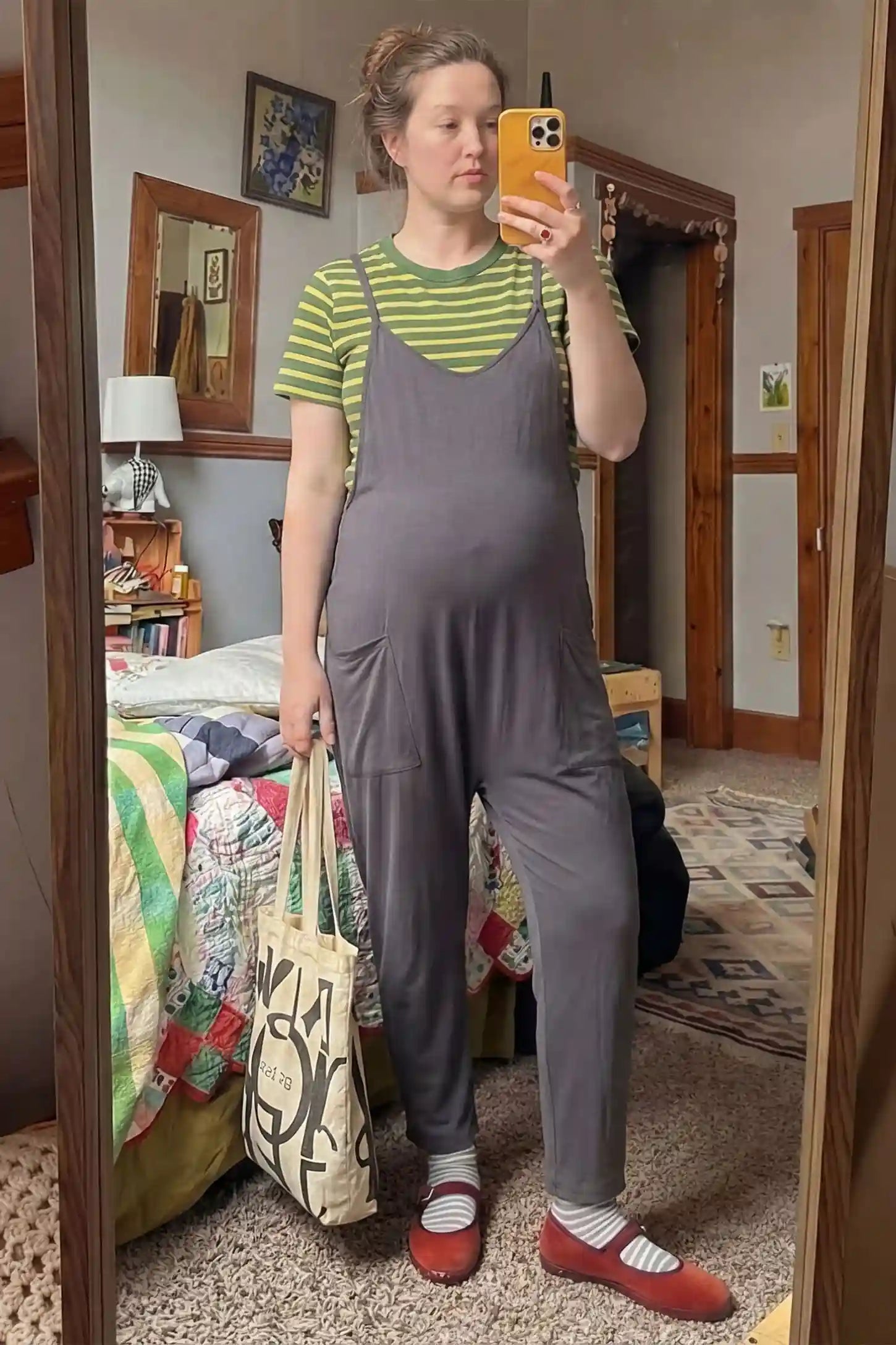 Adjustable Strap Pocketed Relaxed Maternity Jumpsuit Adjustable Strap Pocketed Maternity Jumpsuit in Dark Gray showing soft, breathable fabric on a pregnant model, lifestyle view.