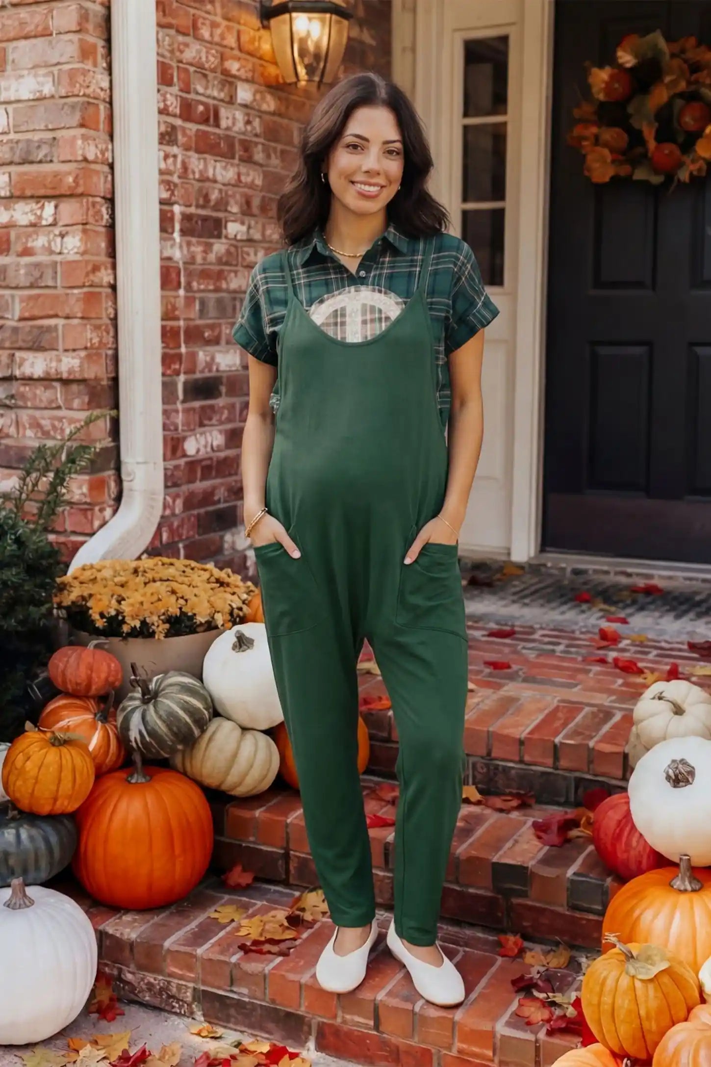 Adjustable Strap Pocketed Relaxed Maternity Jumpsuit Adjustable Strap Pocketed Maternity Jumpsuit in Dark Green showing soft, breathable fabric on a pregnant model, lifestyle view.