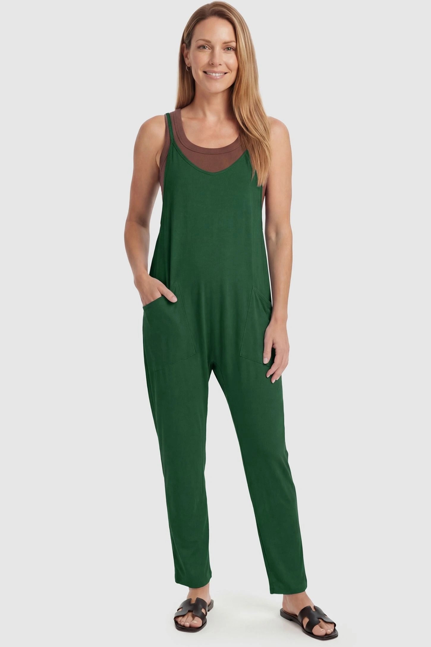 Adjustable Strap Pocketed Relaxed Maternity Jumpsuit Adjustable Strap Pocketed Maternity Jumpsuit in Dark Green featuring a flexible fit on a non-pregnant model, front view.