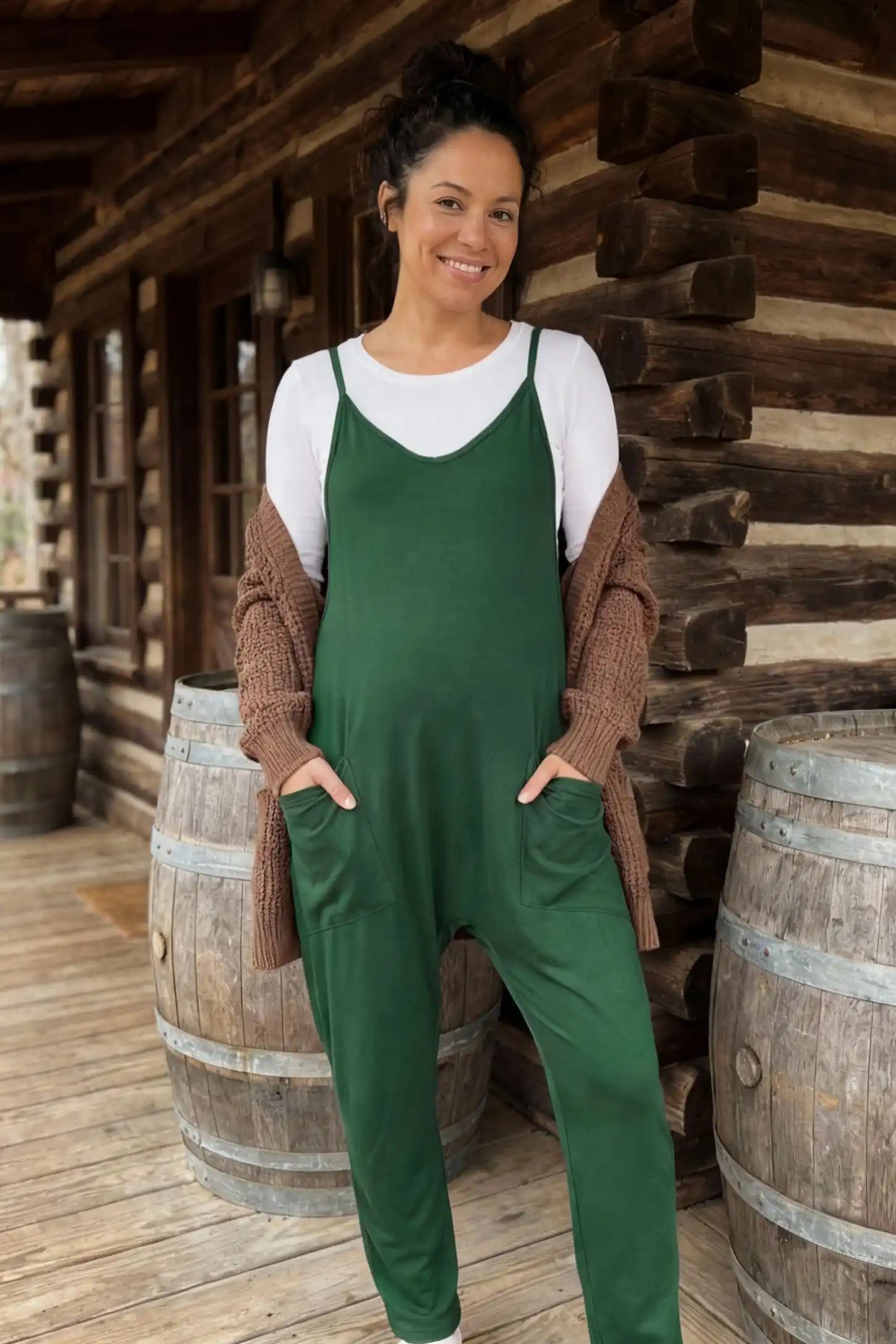 Adjustable Strap Pocketed Relaxed Maternity Jumpsuit Adjustable Strap Pocketed Maternity Jumpsuit in Dark Green showing soft, breathable fabric on a pregnant model, lifestyle view.