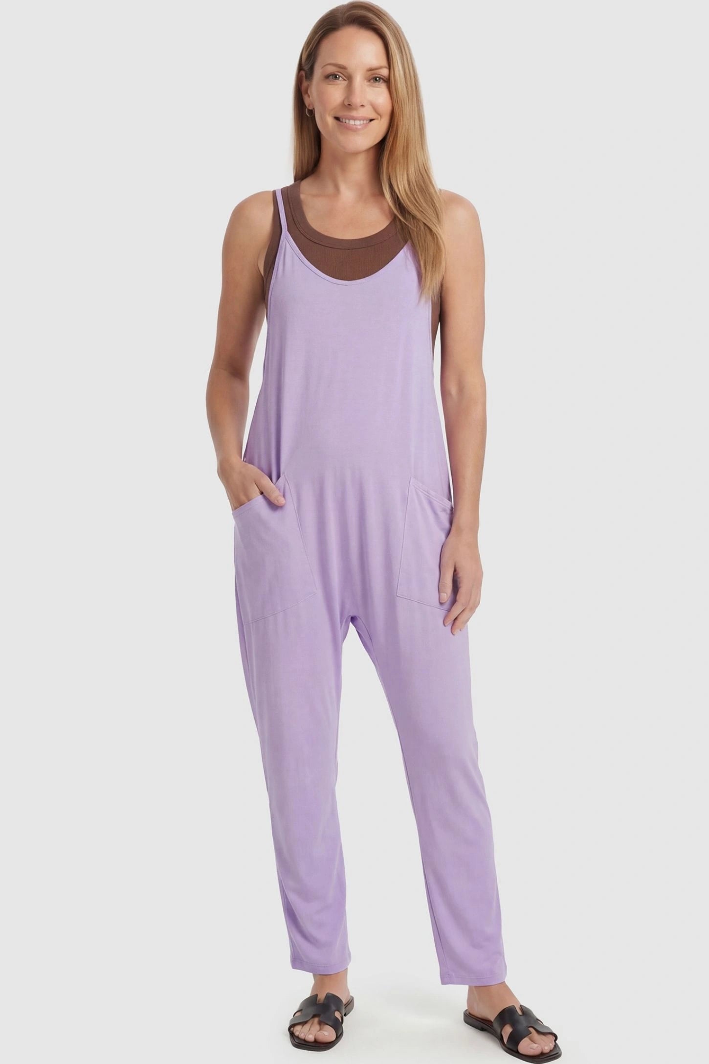 Adjustable Strap Pocketed Relaxed Maternity Jumpsuit Adjustable Strap Pocketed Maternity Jumpsuit in Purple featuring a flexible fit on a non-pregnant model, front view.