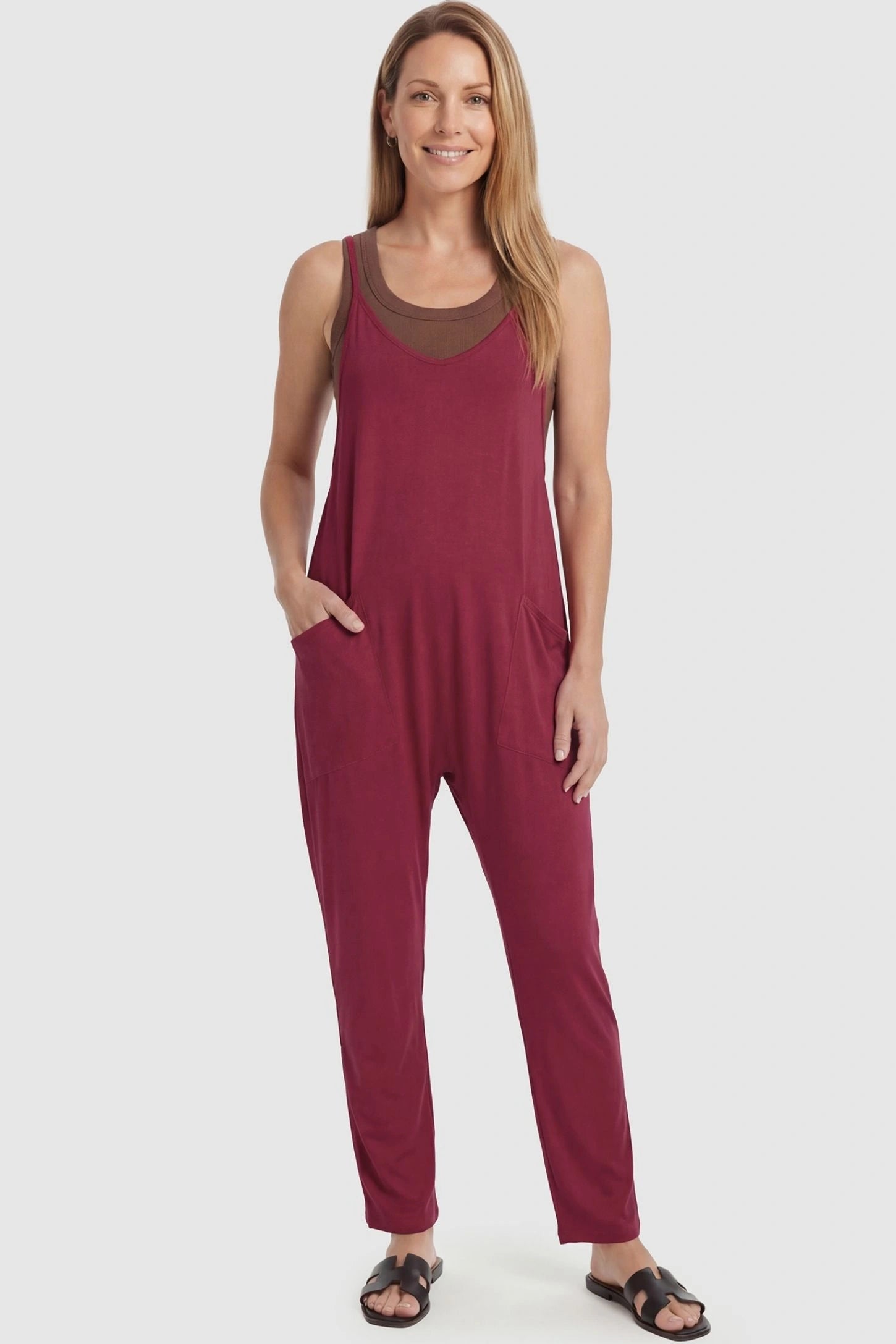 Adjustable Strap Pocketed Relaxed Maternity Jumpsuit Adjustable Strap Pocketed Maternity Jumpsuit in Wine Red featuring a flexible fit on a non-pregnant model, front view.