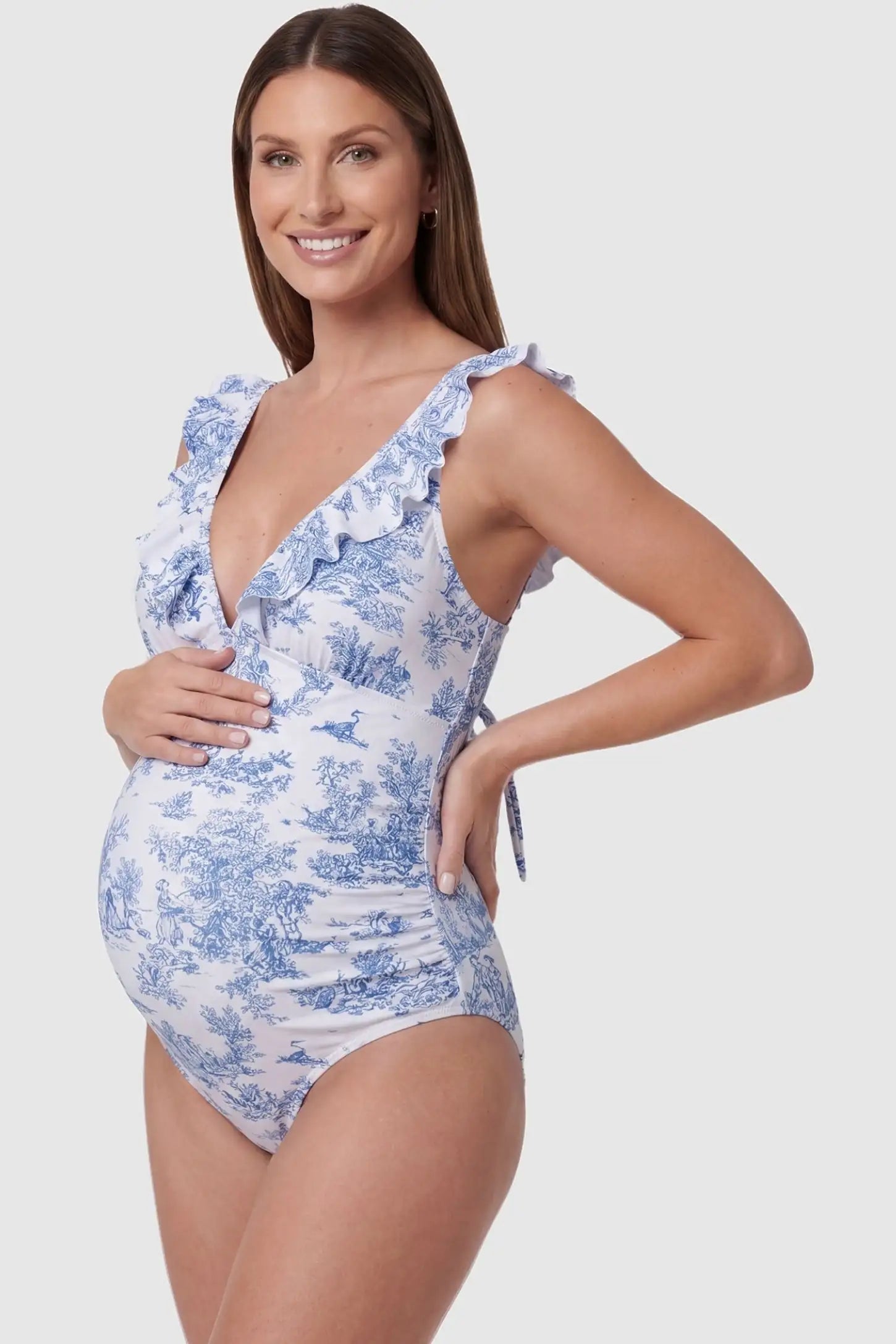 Adjustable Tie-Back V-Neck Maternity One-Piece Swimsuit Blue Landscape Adjustable Tie-Back V-Neck Maternity Swimsuit featuring flexible side-seams on a pregnant model side profile, side view.