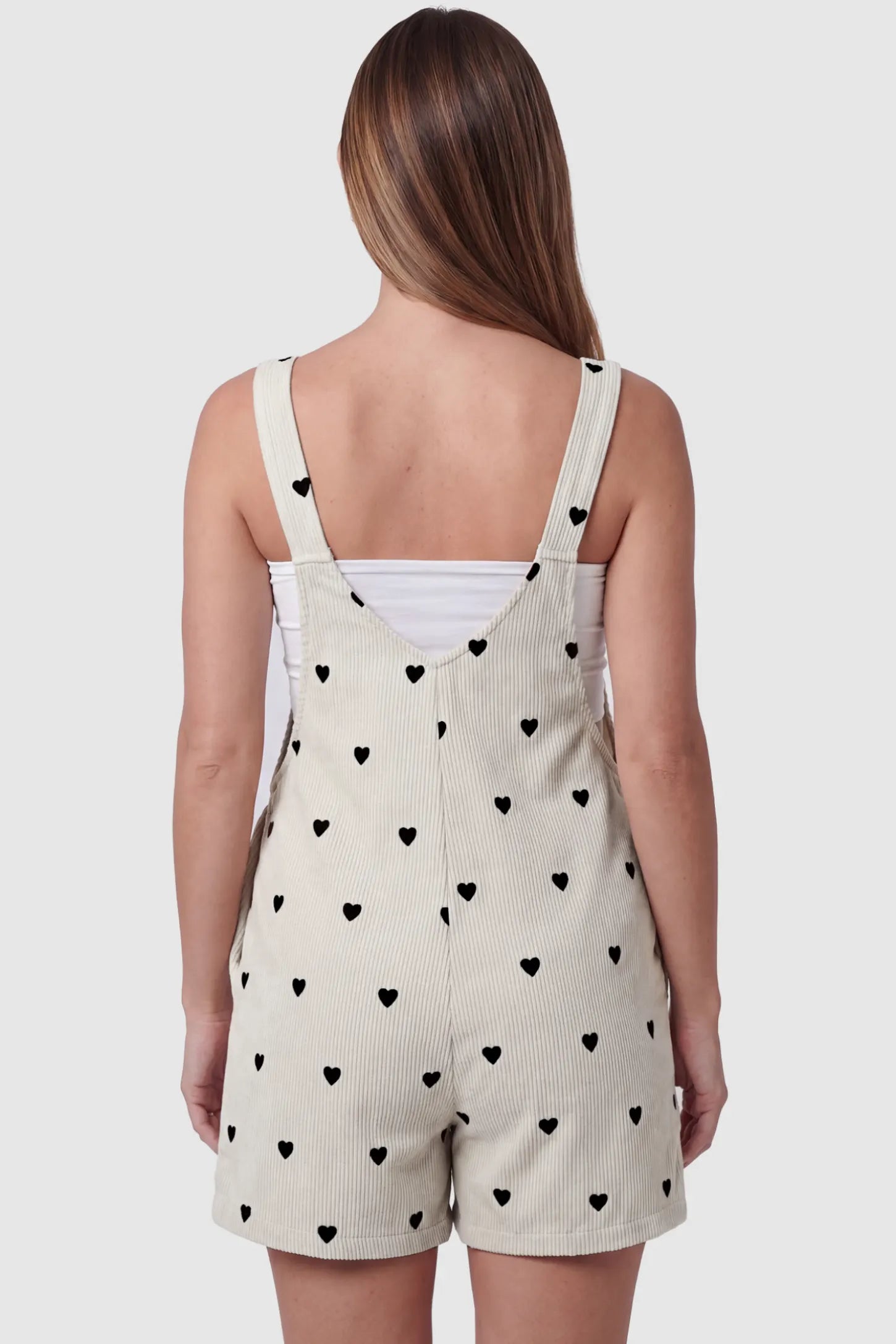 Adjustable Waist Front Pocket Maternity Short Overalls Adjustable Waist Front Pocket Maternity Short Overalls in black featuring cross-back straps on a pregnant model, back view.