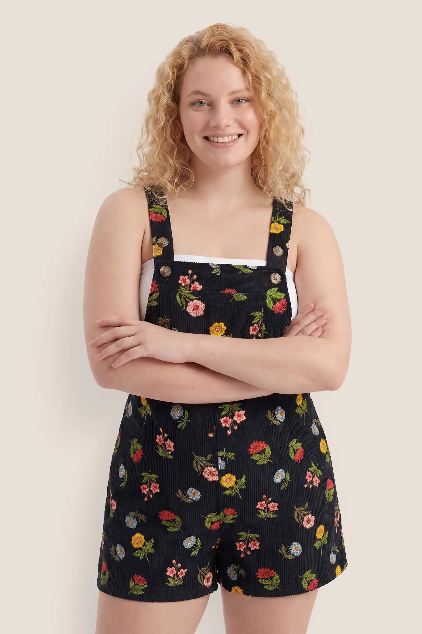 Adjustable Waist Front Pocket Maternity Short Overalls Postpartum front view of the black floral Adjustable Waist Front Pocket Maternity Short Overalls with a relaxed and flattering fit.