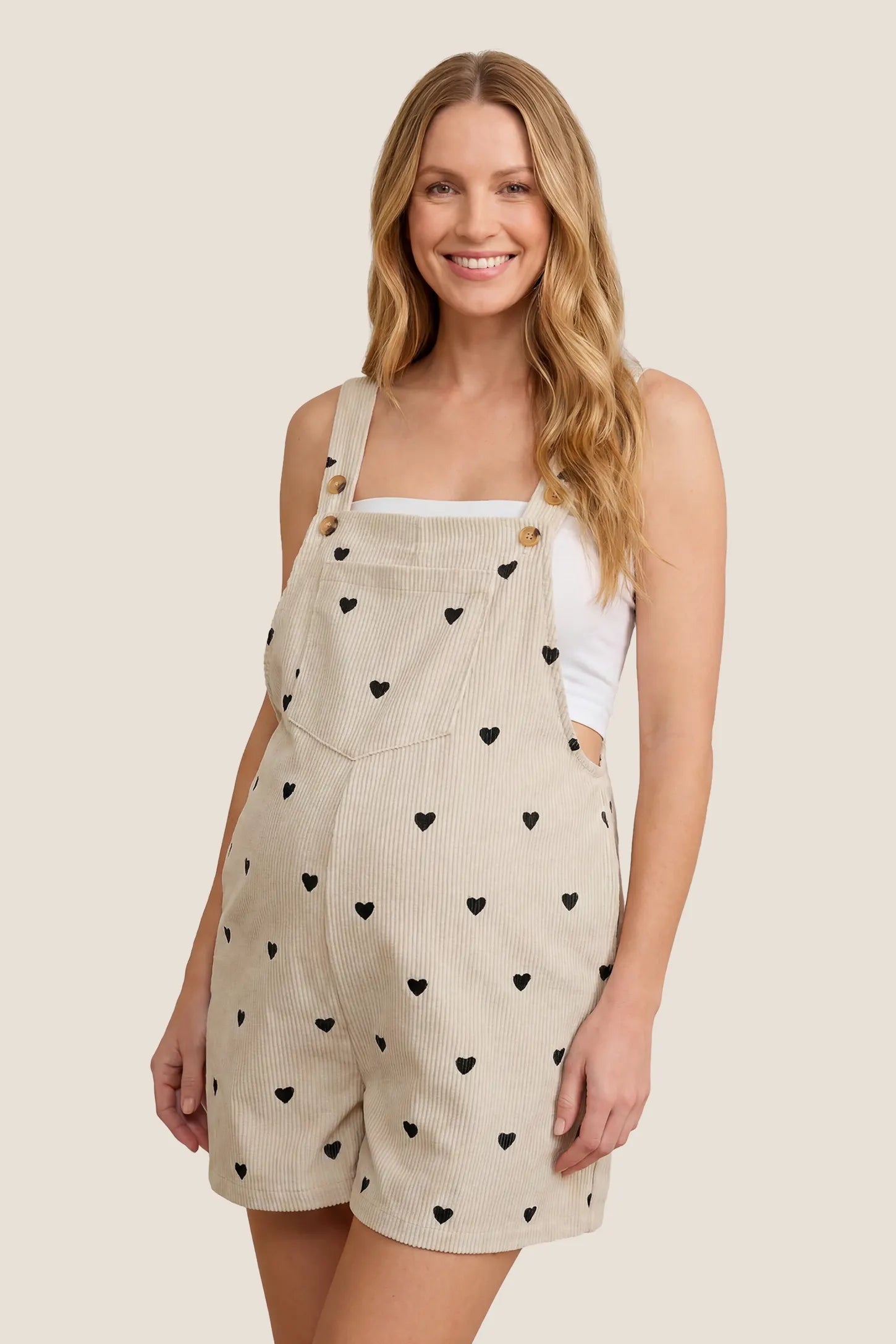 Adjustable Waist Front Pocket Maternity Short Overalls Front view of the black Adjustable Waist Front Pocket Maternity Short Overalls with front pockets and adjustable waist detail.
