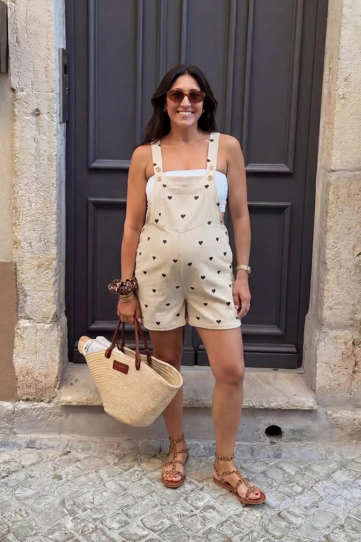 Adjustable Waist Front Pocket Maternity Short Overalls UGC lifestyle image of the black Adjustable Waist Front Pocket Maternity Short Overalls worn for an everyday summer maternity look