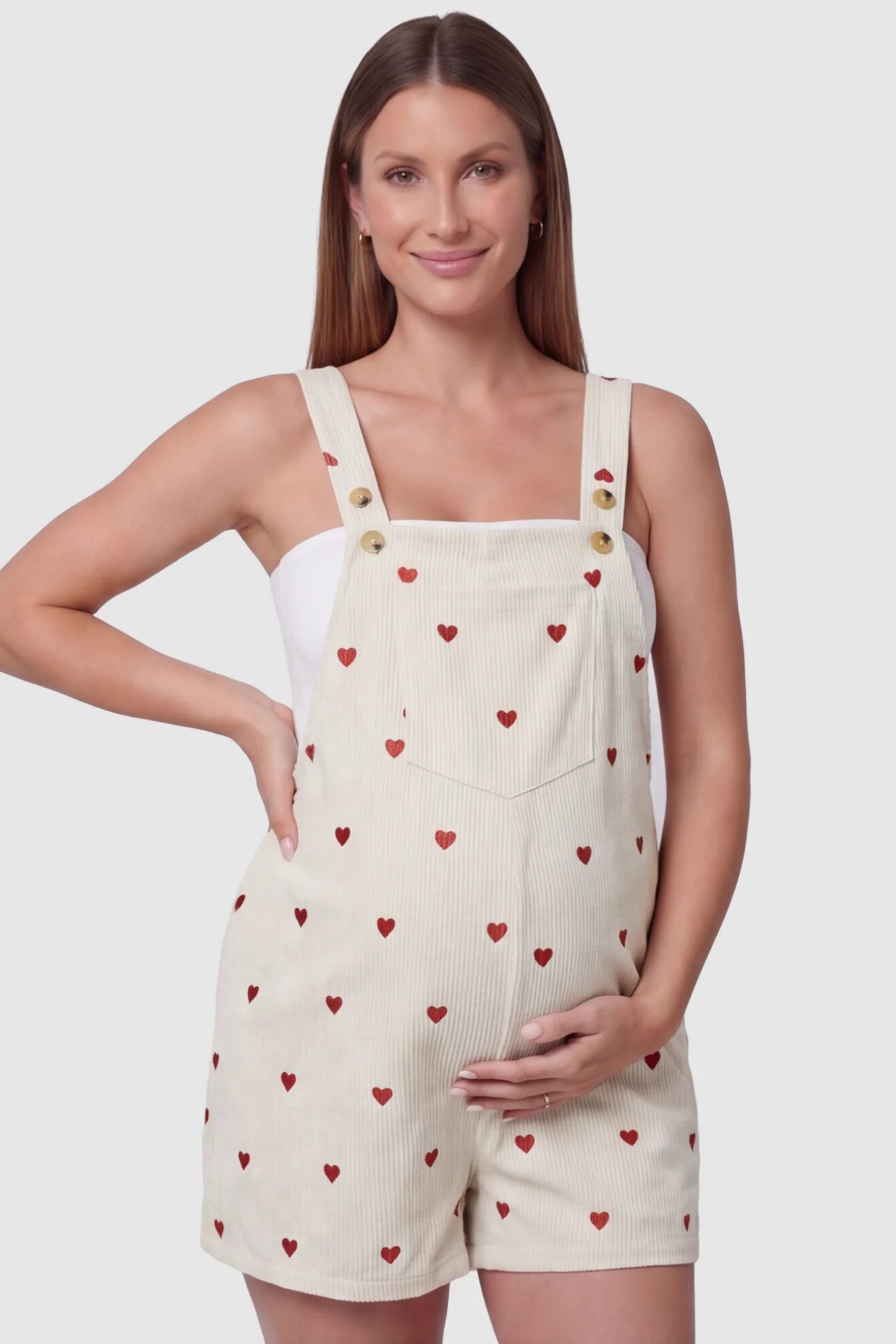 Adjustable Waist Front Pocket Maternity Short Overalls Adjustable Waist Front Pocket Maternity Short Overalls in red featuring an adjustable waist and front bib pocket on a pregnant model, front view.