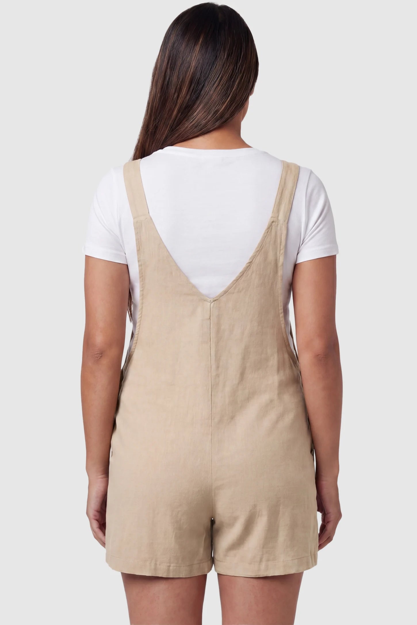 Adjustable Waist Pocketed Maternity Short Overalls Adjustable Waist Pocketed Maternity Short Overalls in Beige featuring a V-shaped back and wide straps on a model, back view.
