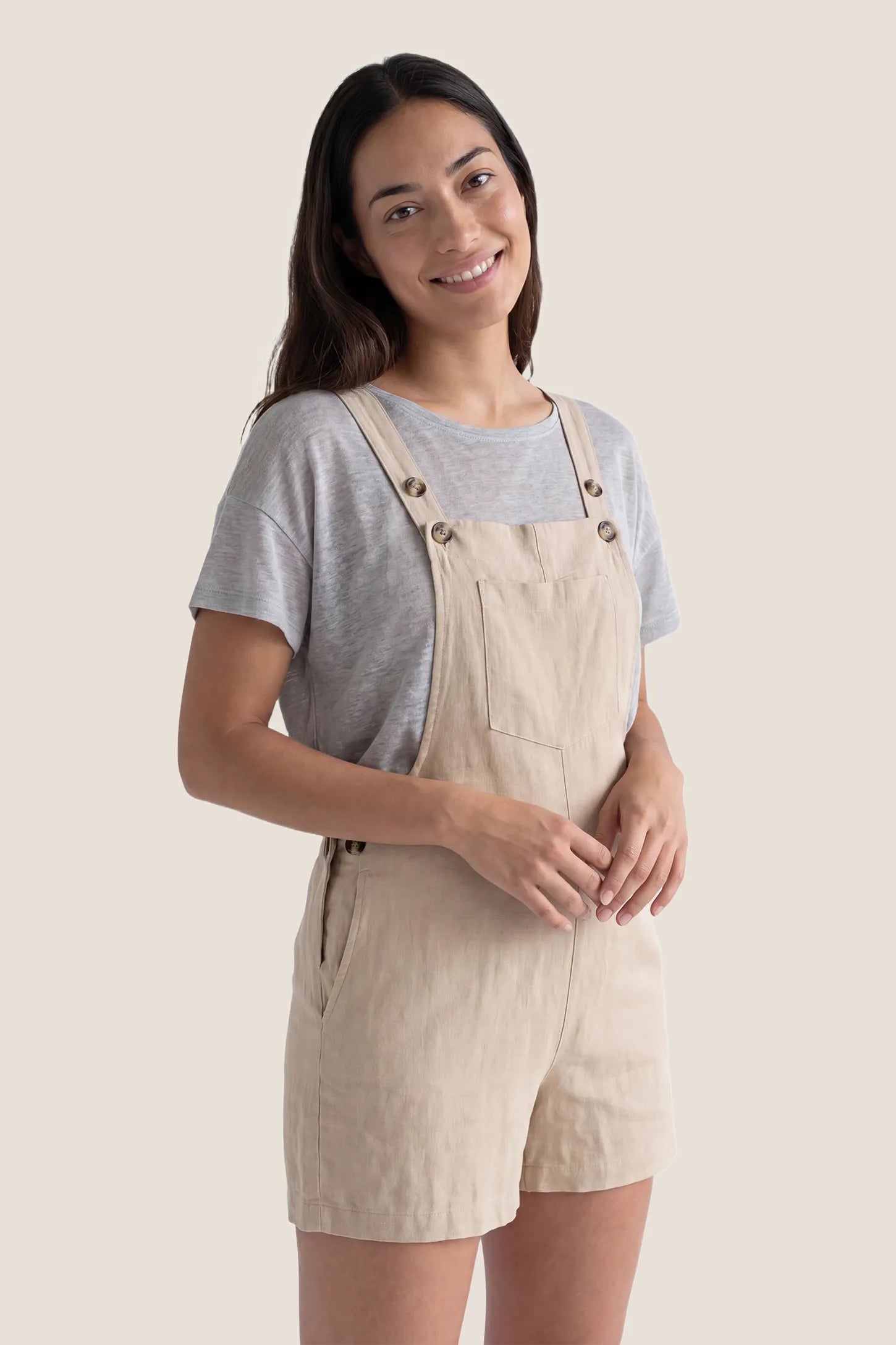 Adjustable Waist Pocketed Maternity Short Overalls Postpartum front view of the beige Adjustable Waist Pocketed Maternity Short Overalls with a relaxed and flattering fit.