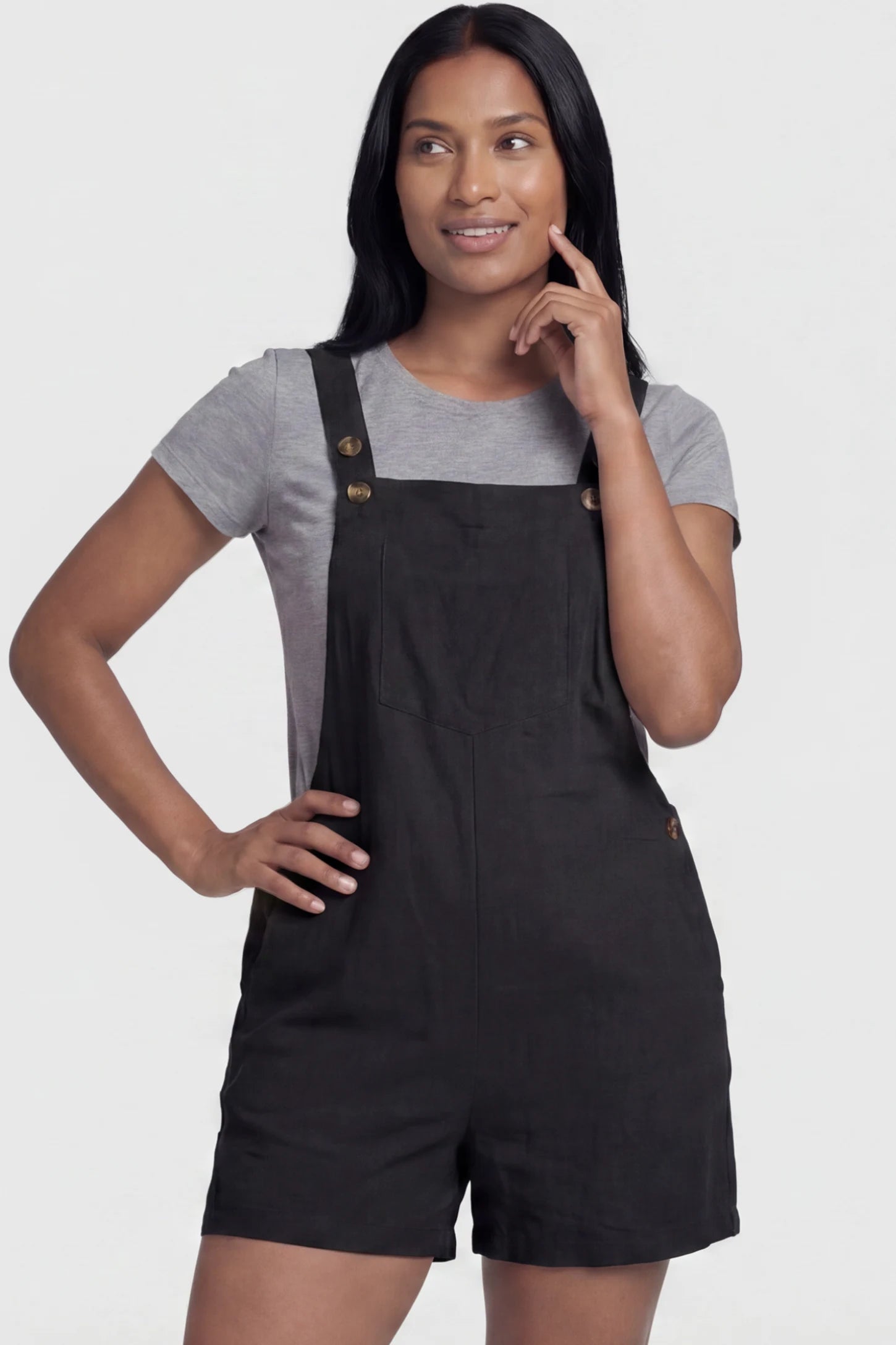 Adjustable Waist Pocketed Maternity Short Overalls Adjustable Waist Pocketed Maternity Short Overalls in Black featuring a bib pocket on a postpartum model, front view.