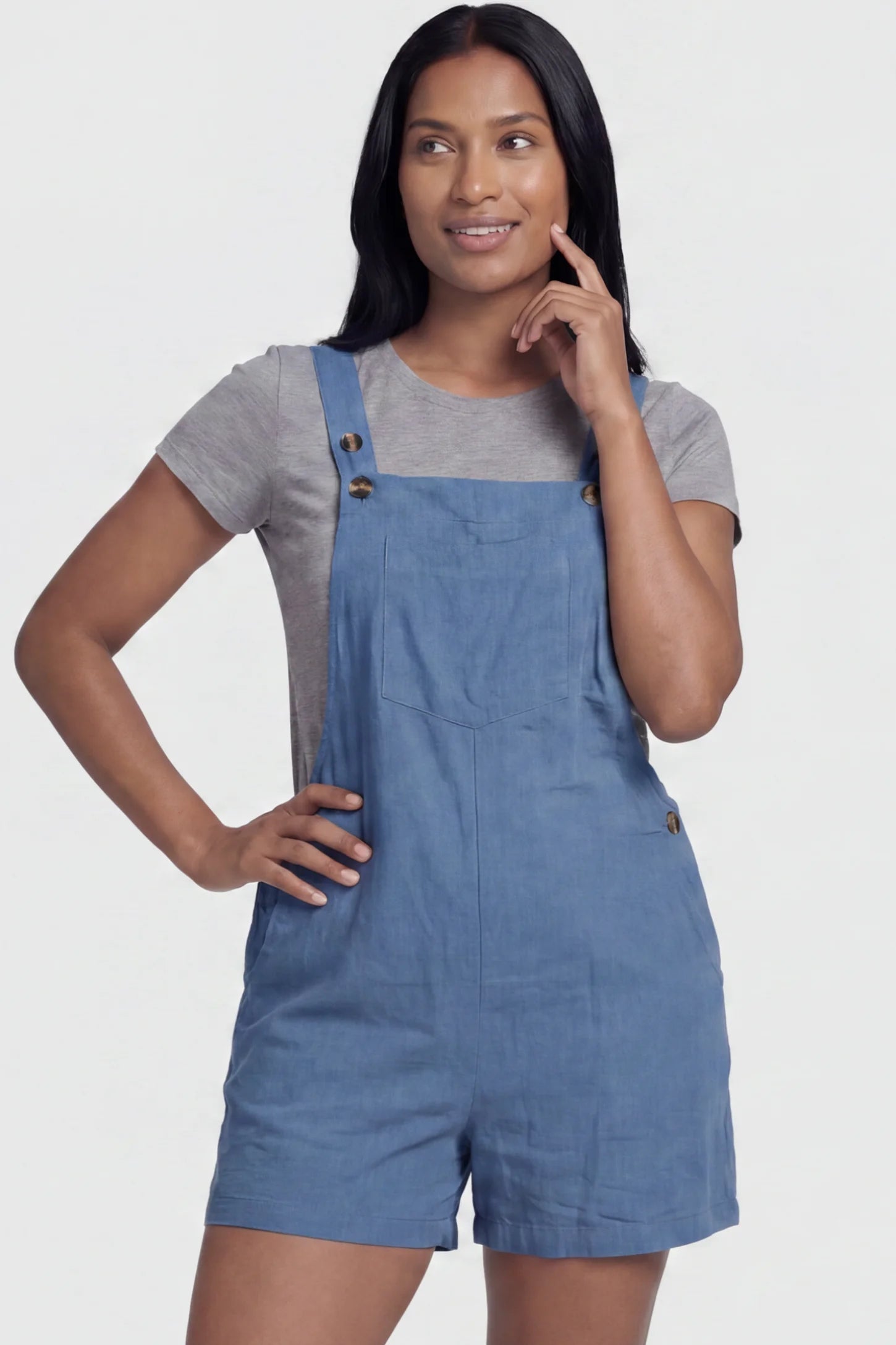 Adjustable Waist Pocketed Maternity Short Overalls Adjustable Waist Pocketed Maternity Short Overalls in Blue featuring a bib pocket on a postpartum model, front view.