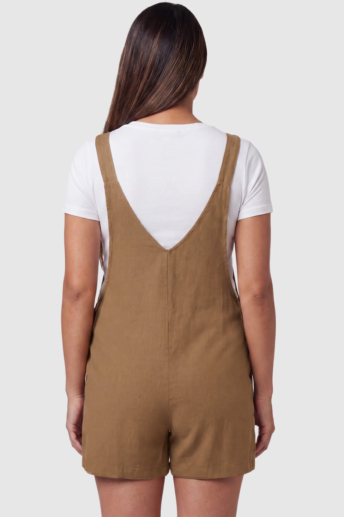 Adjustable Waist Pocketed Maternity Short Overalls Adjustable Waist Pocketed Maternity Short Overalls in Brown featuring a V-shaped back and wide straps on a model, back view.