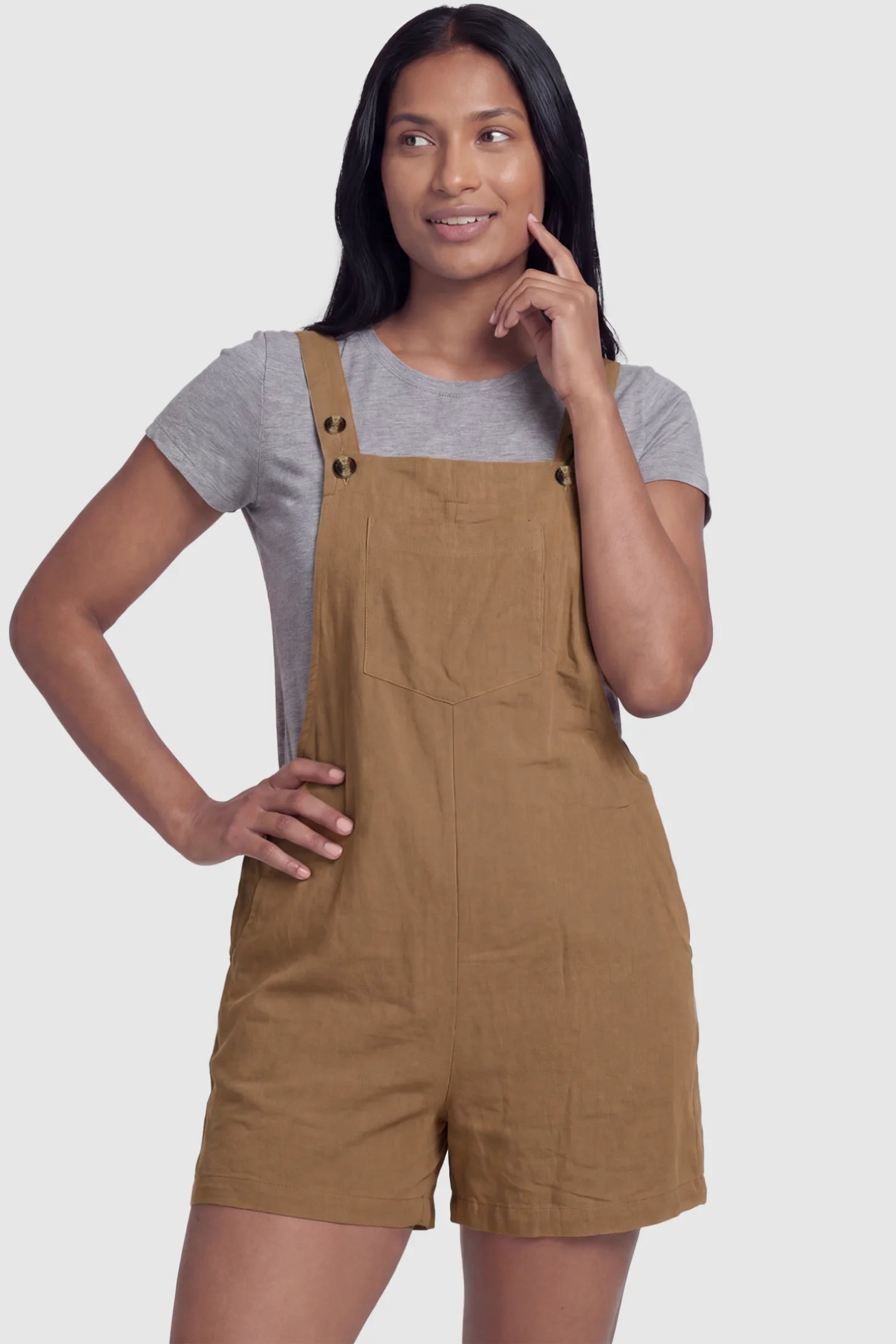 Adjustable Waist Pocketed Maternity Short Overalls Adjustable Waist Pocketed Maternity Short Overalls in Brown featuring a bib pocket on a postpartum model, front view.