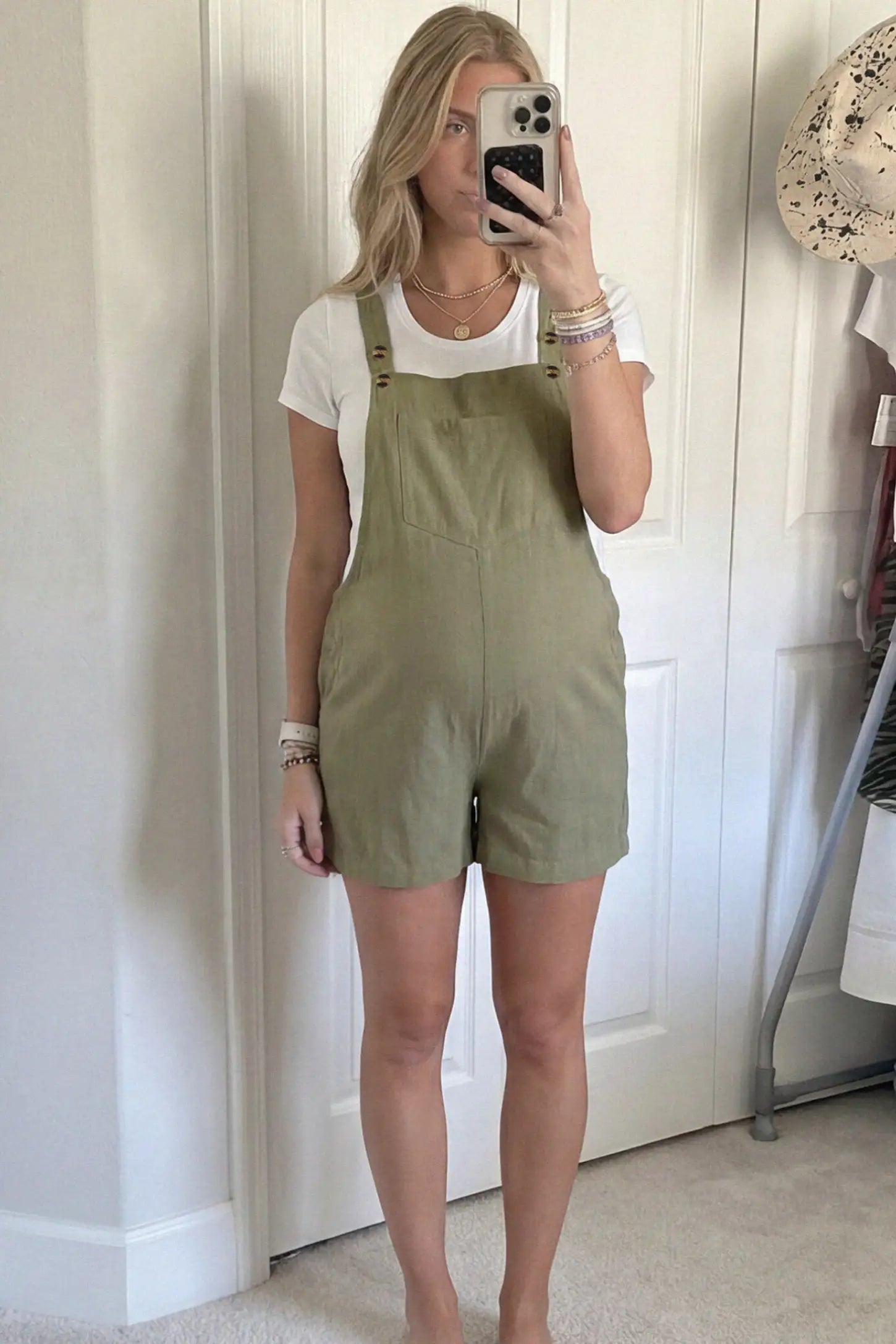 Adjustable Waist Pocketed Maternity Short Overalls Adjustable Waist Pocketed Maternity Short Overalls in Green featuring a bib pocket on a pregnant woman in indoor setting, front view.