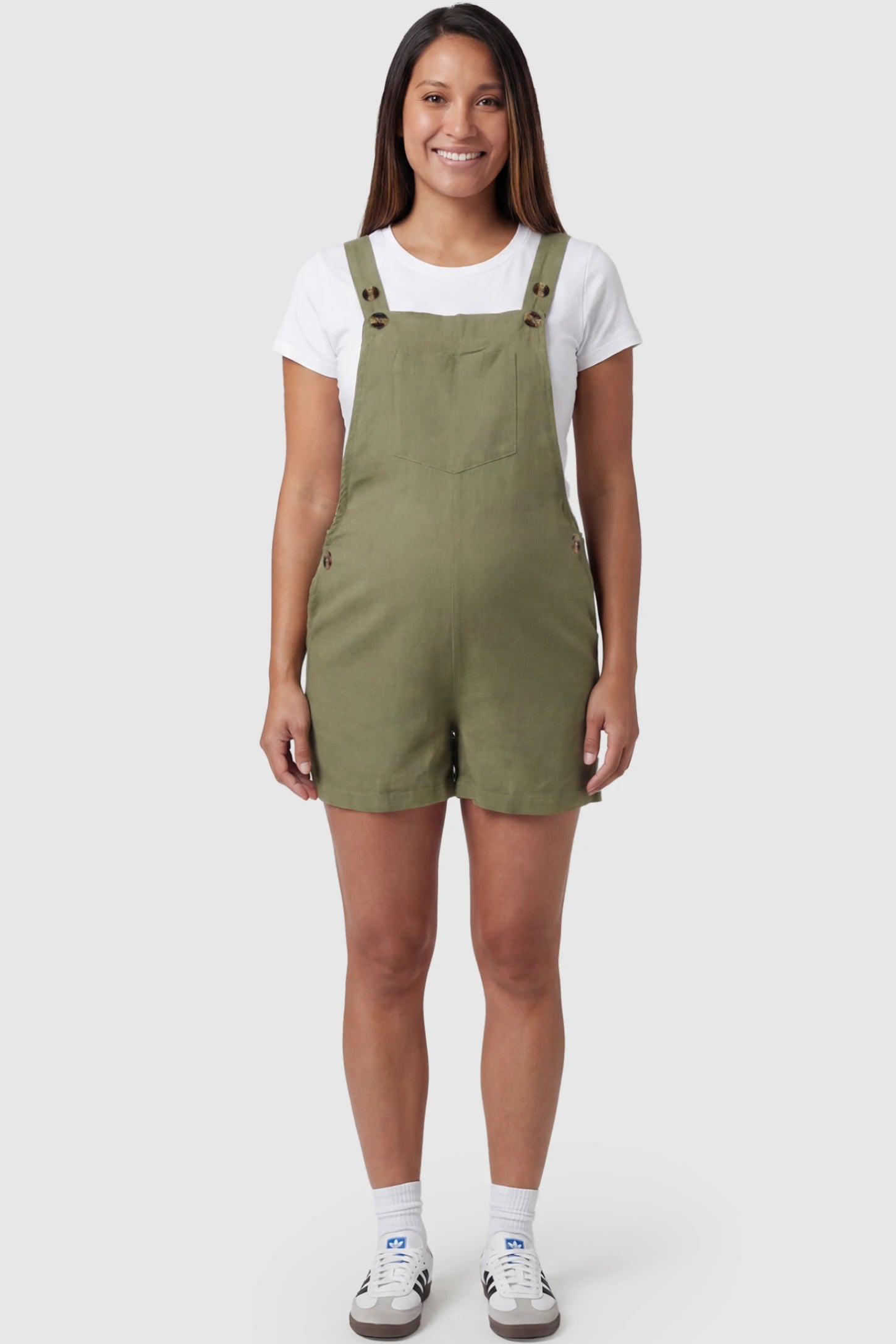 Adjustable Waist Pocketed Maternity Short Overalls Adjustable Waist Pocketed Maternity Short Overalls in Green featuring a bib pocket on a pregnant model, full body view.