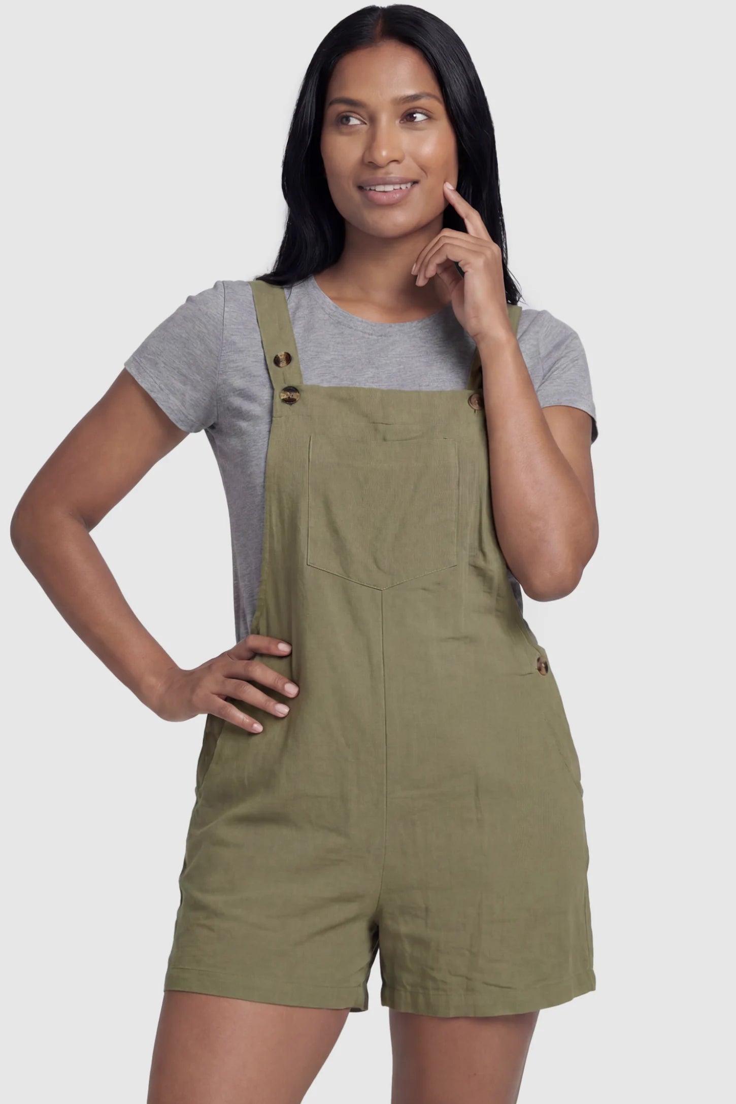 Adjustable Waist Pocketed Maternity Short Overalls Adjustable Waist Pocketed Maternity Short Overalls in Green featuring a bib pocket on a postpartum model, front view.
