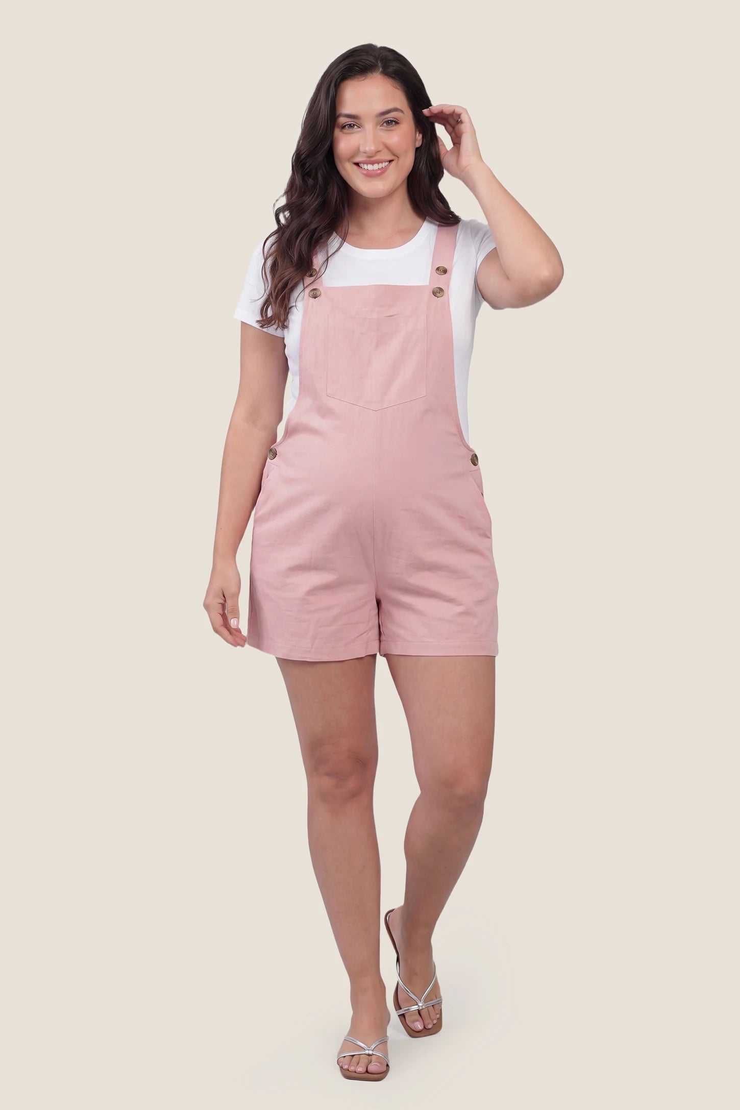 Adjustable Waist Pocketed Maternity Short Overalls Complete look of the pink Adjustable Waist Pocketed Maternity Short Overalls styled for casual everyday maternity wear.
