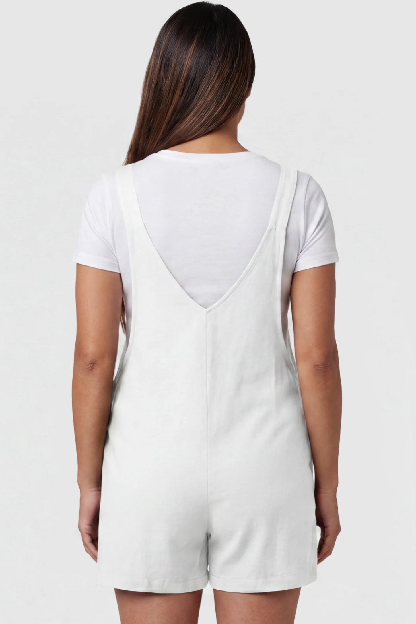 Adjustable Waist Pocketed Maternity Short Overalls Adjustable Waist Pocketed Maternity Short Overalls in White featuring a V-shaped back and wide straps on a model, back view.