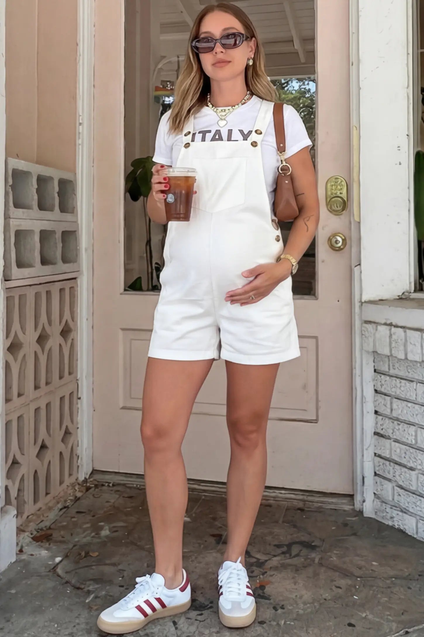 Adjustable Waist Pocketed Maternity Short Overalls Adjustable Waist Pocketed Maternity Short Overalls in White featuring a bib pocket on a pregnant woman in outdoor setting, front view.