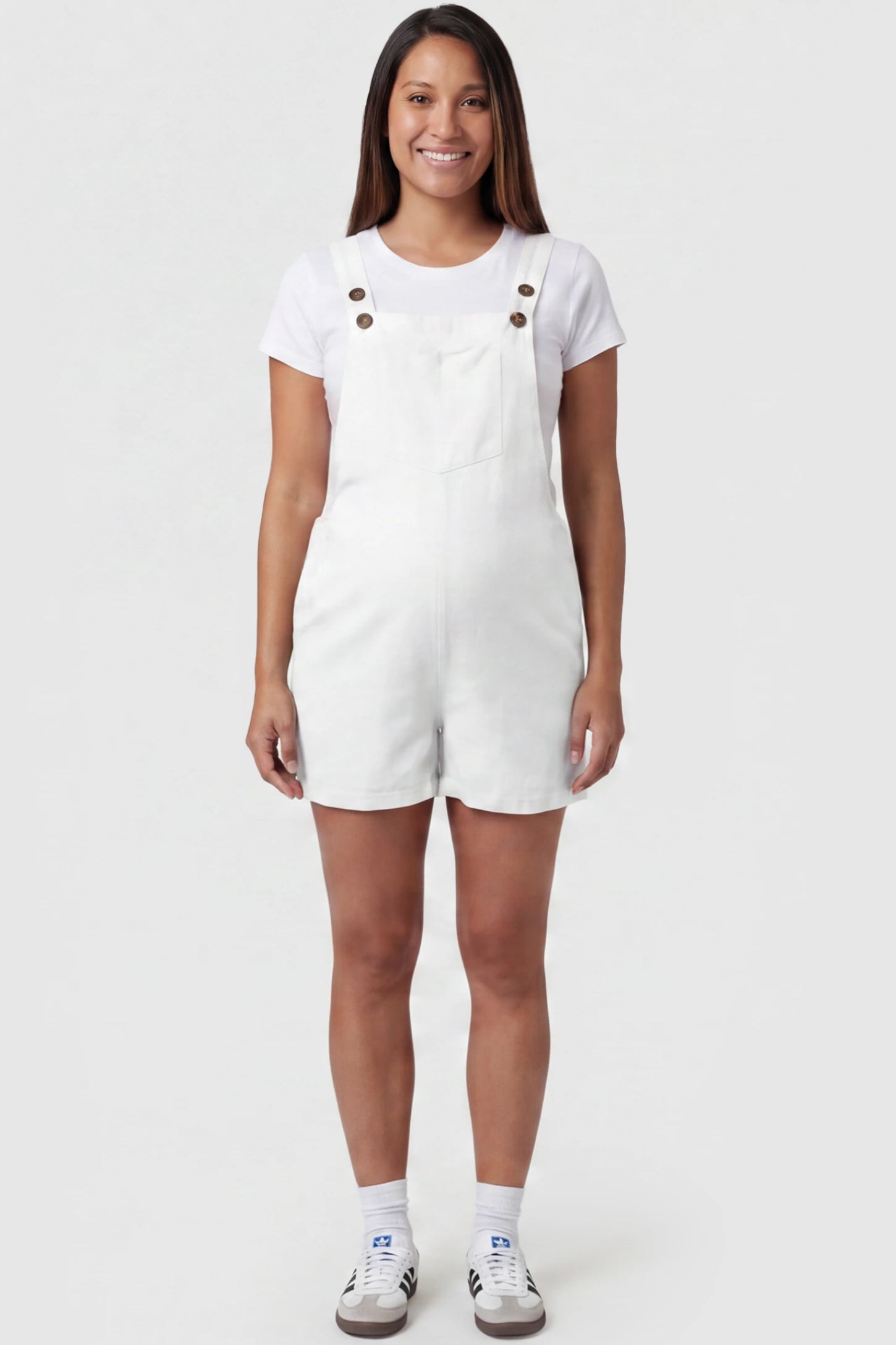 Adjustable Waist Pocketed Maternity Short Overalls Adjustable Waist Pocketed Maternity Short Overalls in White featuring a bib pocket on a pregnant model, full body view.
