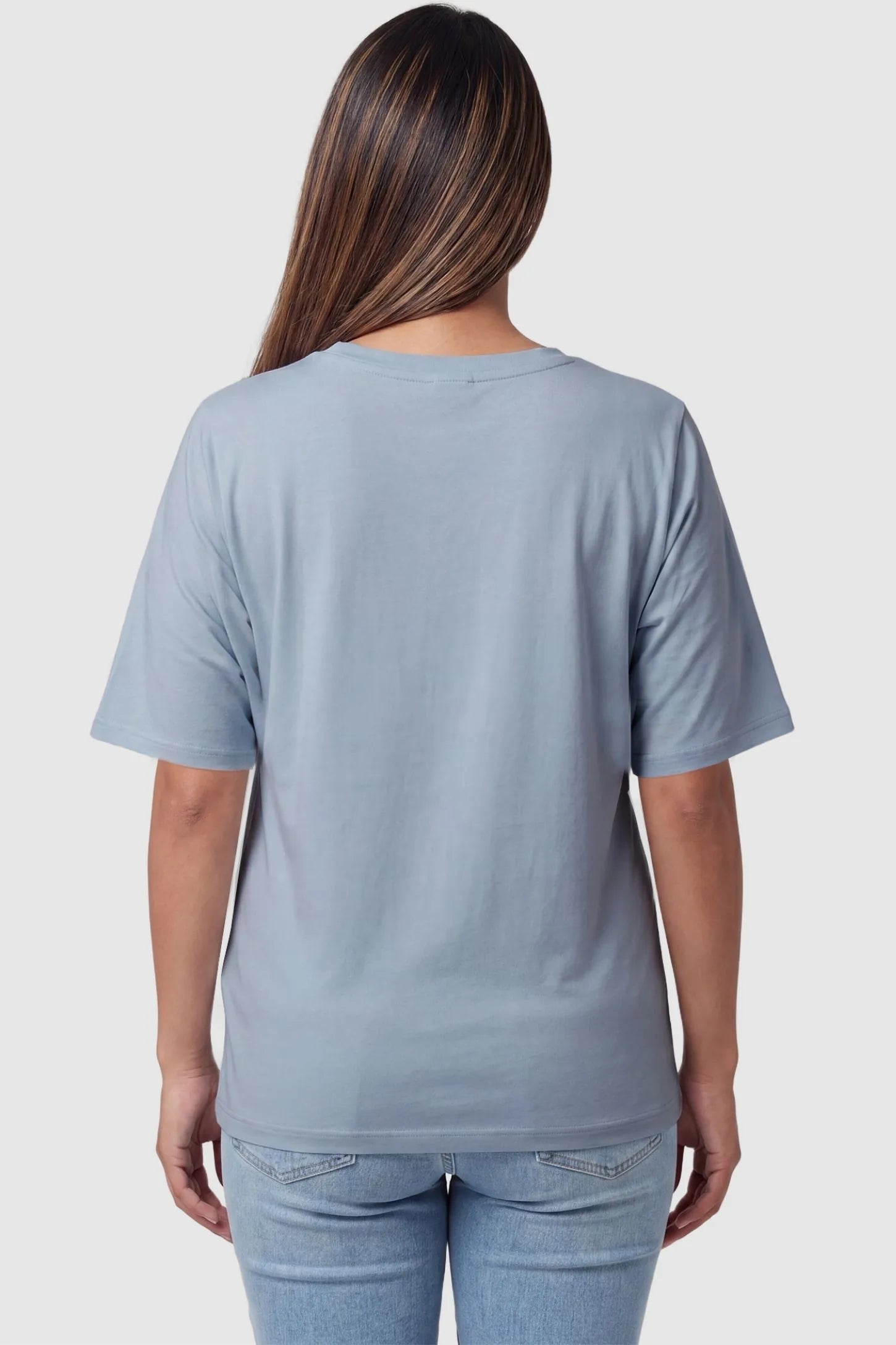 Asymmetrical Hem Relaxed Short Sleeve Maternity Top Back view of Asymmetrical Hem Relaxed Short Sleeve Maternity Top in Blue featuring a clean crew neckline on a pregnant model.