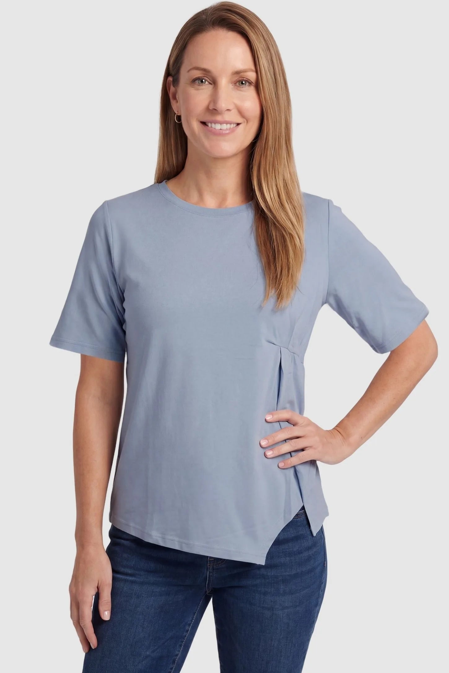 Asymmetrical Hem Relaxed Short Sleeve Maternity Top Front view of Asymmetrical Hem Relaxed Short Sleeve Maternity Top in Blue featuring a relaxed fit on a postpartum model.