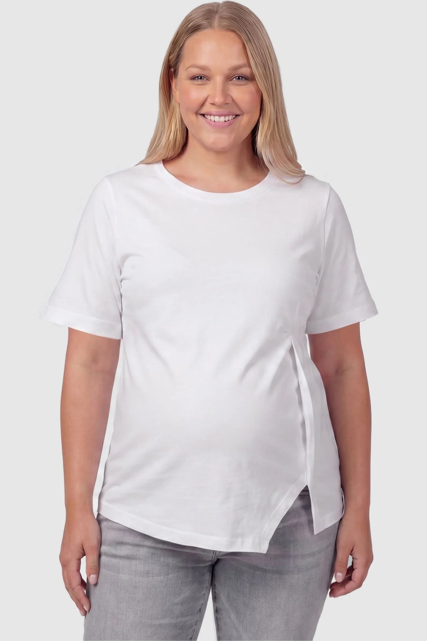 Asymmetrical Hem Relaxed Short Sleeve Maternity Top Front view of Asymmetrical Hem Relaxed Short Sleeve Maternity Top in White featuring a stretchy cut on a plus-size pregnant model.