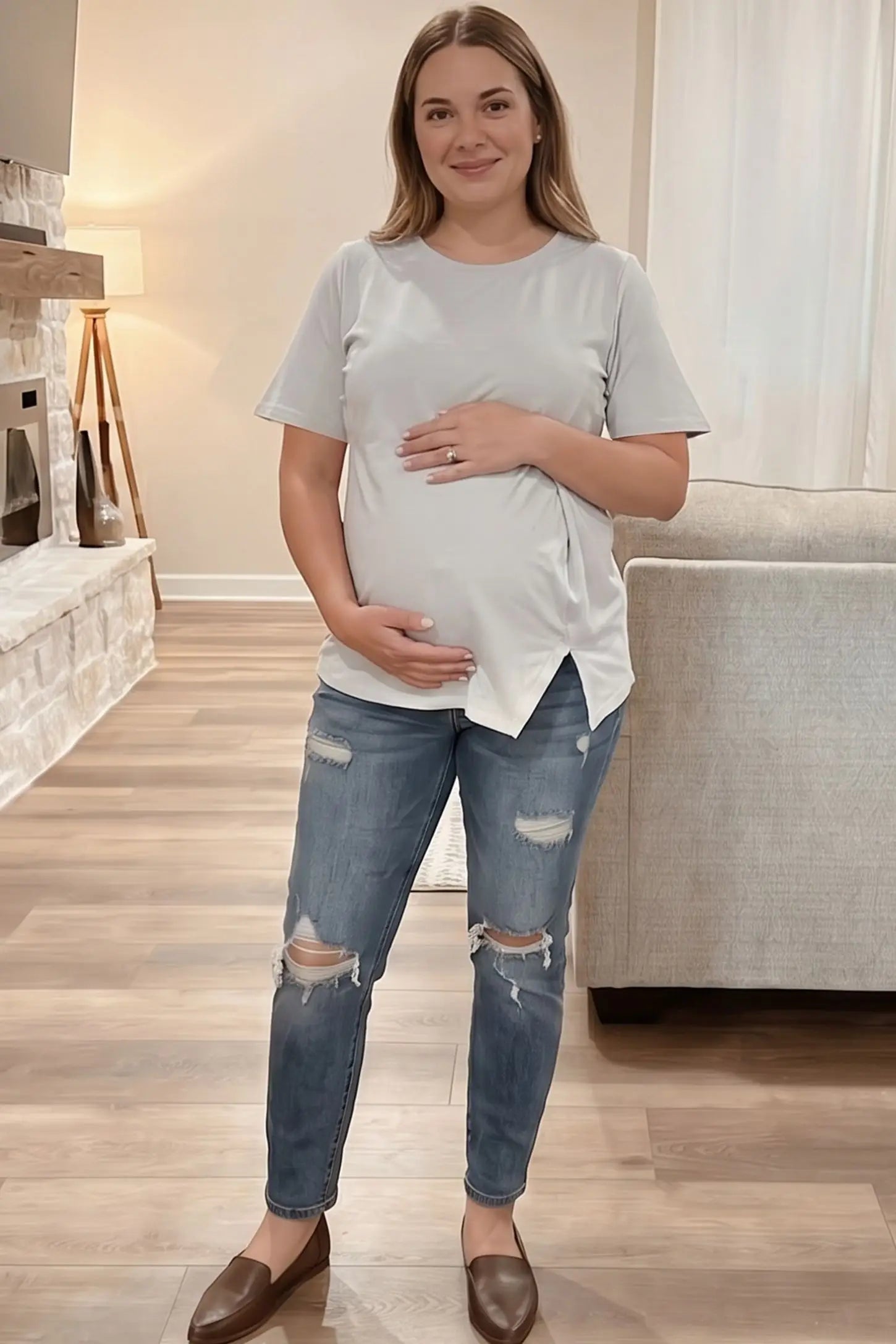 Asymmetrical Hem Relaxed Short Sleeve Maternity Top Front view of Asymmetrical Hem Relaxed Short Sleeve Maternity Top in White featuring a casual cotton blend on a pregnant model.