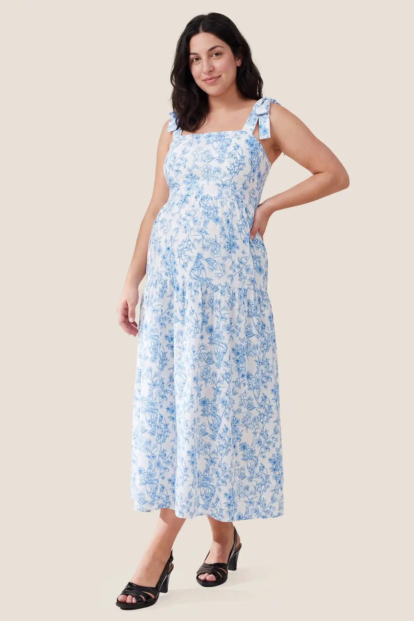 Floral Cami Tiered Maxi Maternity Dress Front view of the Floral Cami Tiered Maxi Maternity Dress on a plus-size pregnant model, emphasizing the comfortable fit.