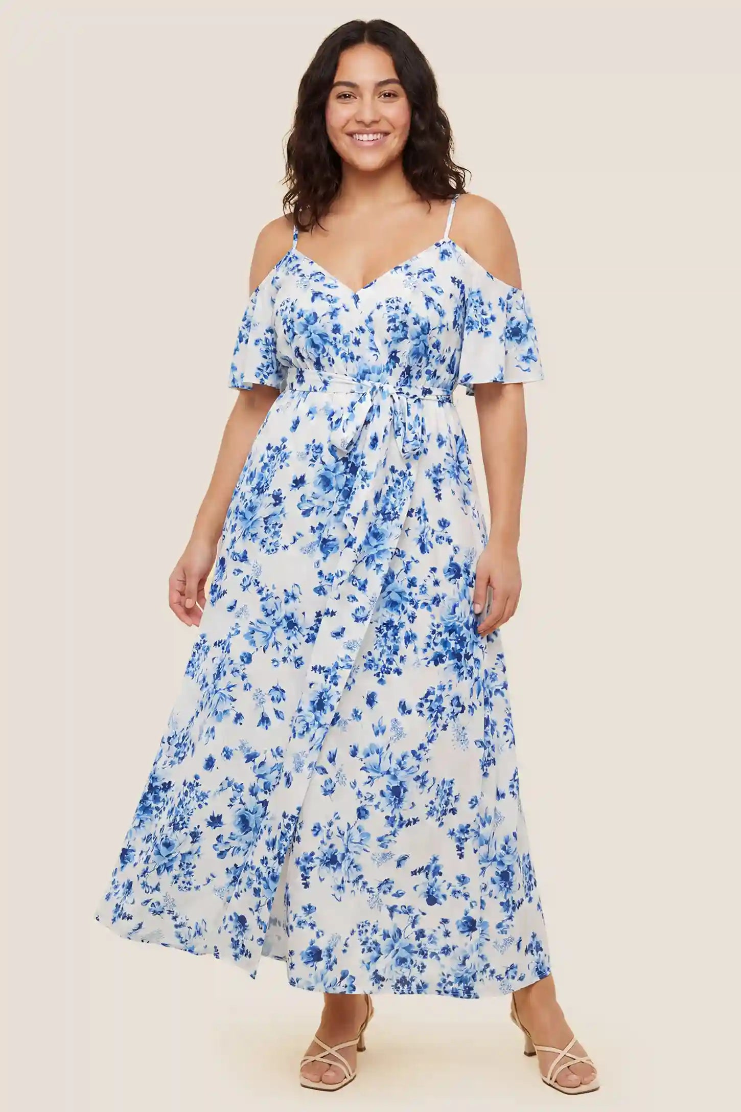 Elegant Floral Cold Shoulder Maternity Maxi Dress with Slit Blue and white floral cold shoulder maternity maxi dress with a high slit, worn by a pregnant model.