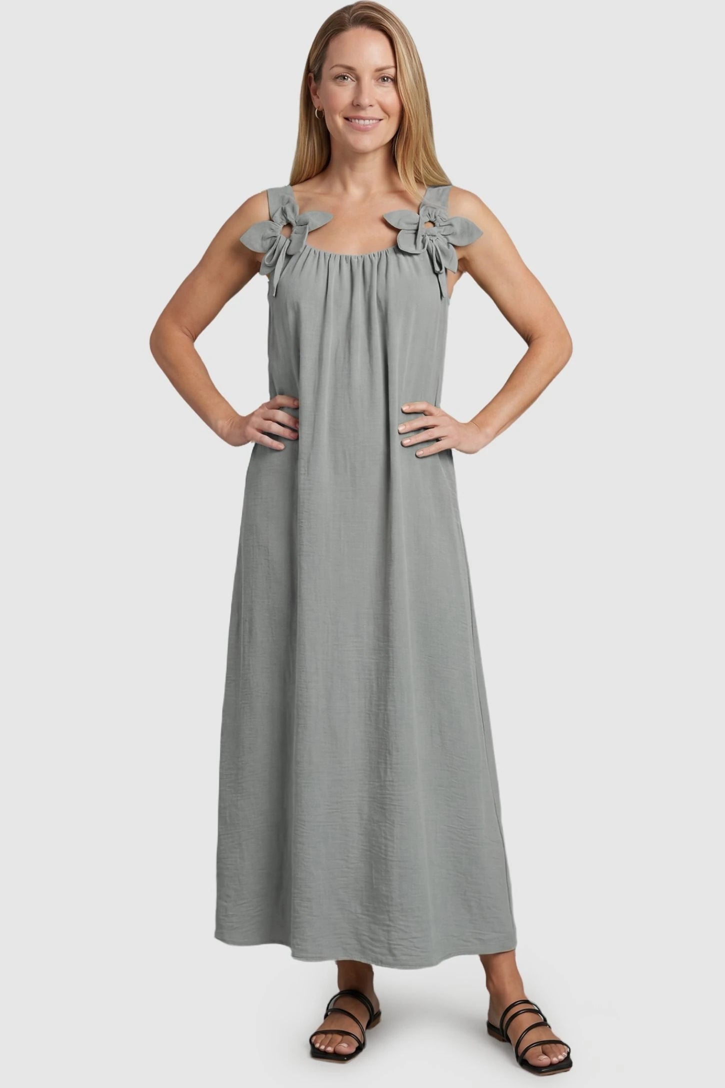 Bow Strap A-Line Maternity Dress Gray Bow Strap A-Line Maternity Dress on a postpartum model showcasing the elegant sleeveless design.