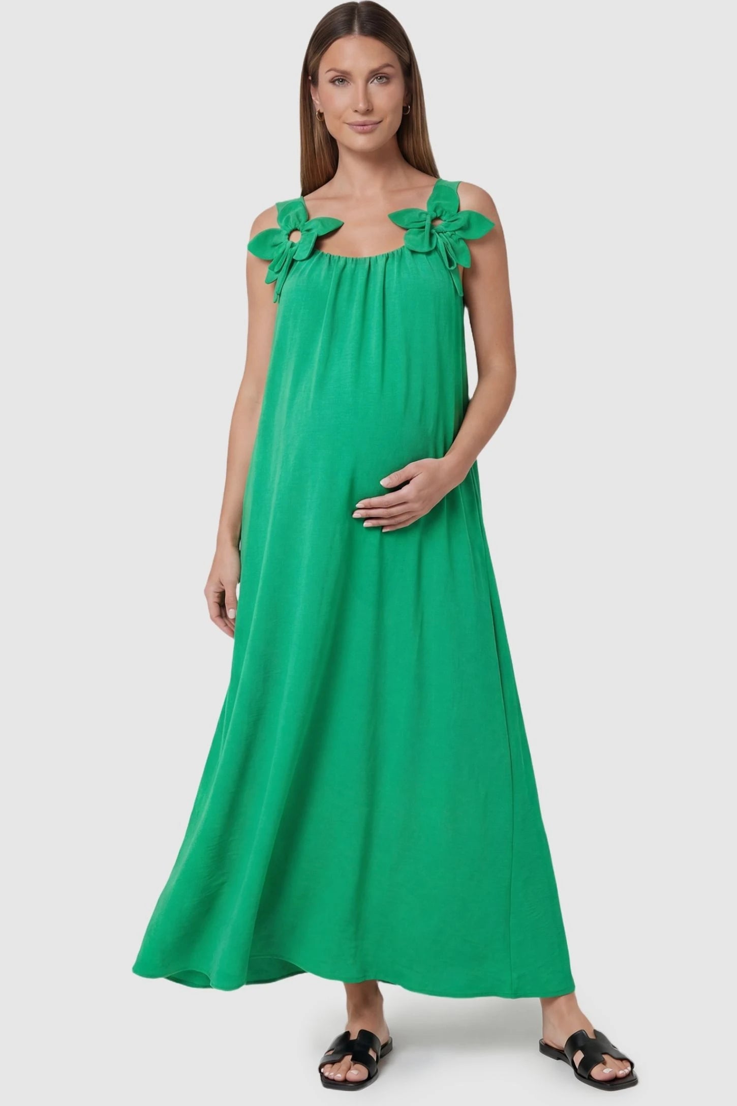 Bow Strap A-Line Maternity Dress Green Bow Strap A-Line Maternity Dress with oversized floral ties on a front-facing pregnant model.