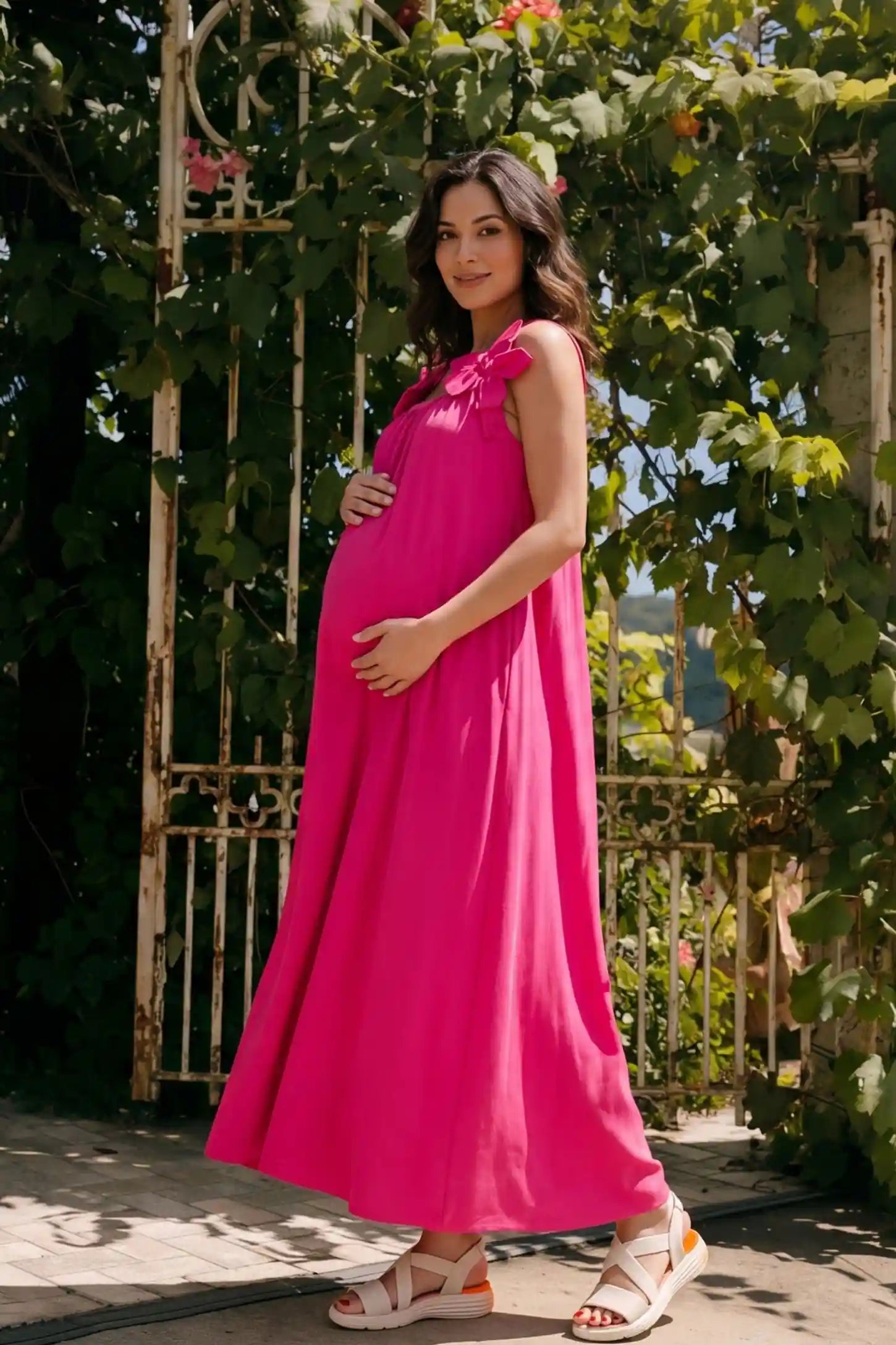 Bow Strap A-Line Maternity Dress Side profile of Pink Bow Strap A-Line Maternity Dress showing the bump-friendly A-line cut on a model.